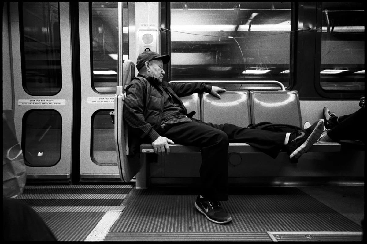 #0469_27A - Sleeping Man, Muni Train. San Francisco, CA. September of 2016.