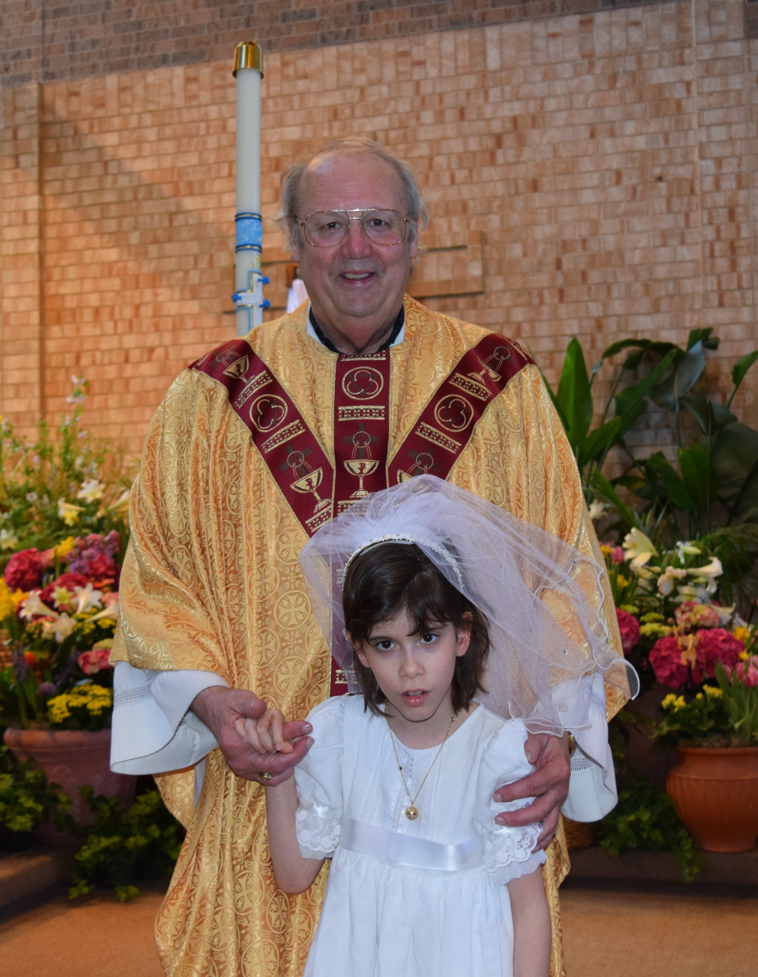 Fr Ryan and Natalia 1st communion 2.jpeg