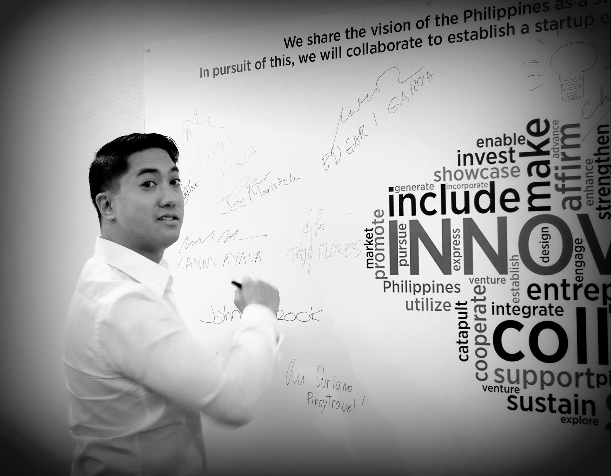 Joe scribbling on a whiteboard at a DTI office in Makati . Photo Credit: JoeMaristela.com