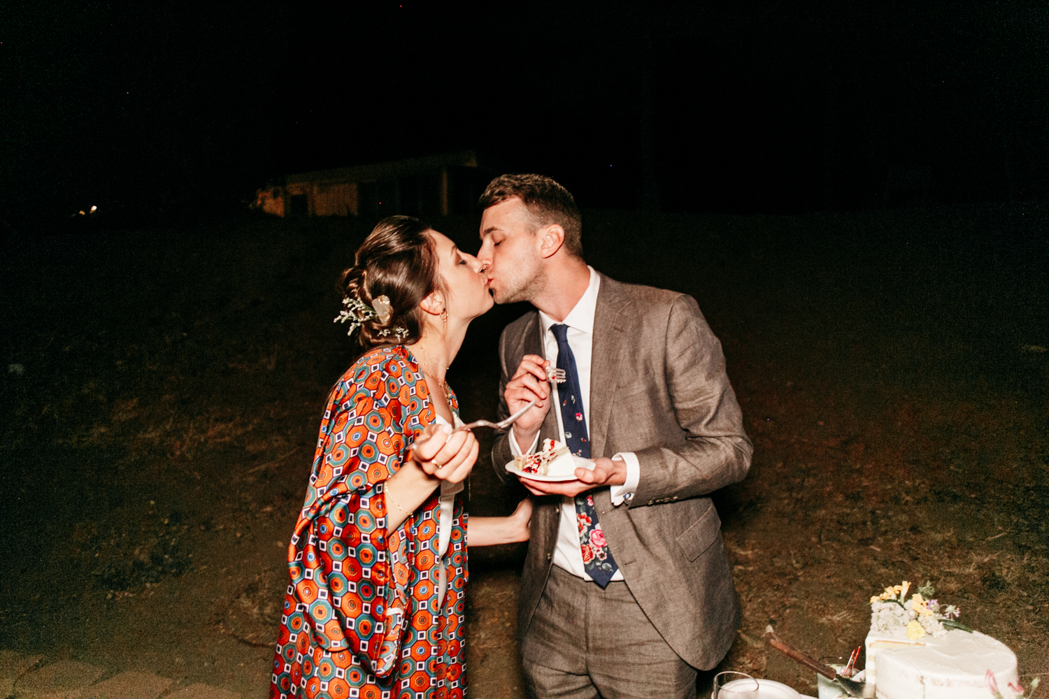 SamErica Studios - wedding cake cutting kiss