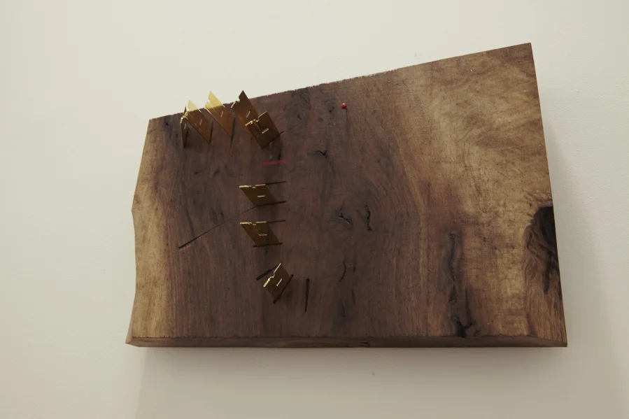 "Study for Motion": Razor Blades, 23 Kt gold, mixed media on found wood. 13 1/4 x 8 1/4 x 3 inches. 2016