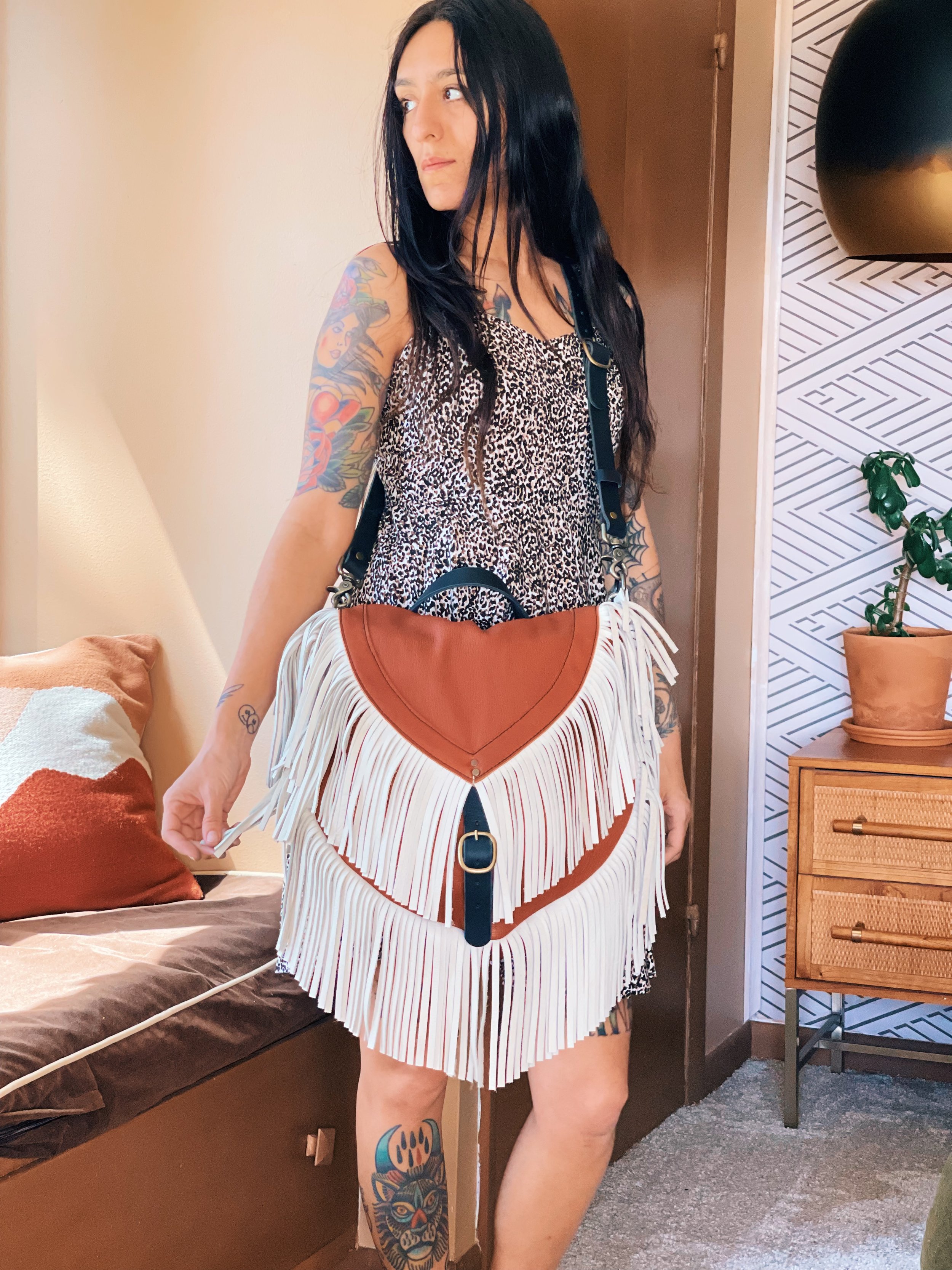  BODY: tobacco bison  FRINGE: custom requested bone leather - may we recommend our white cowhide option for a similar look.  CUSTOM REQUESTS: center rear top D Ring for another backpack convertible option  