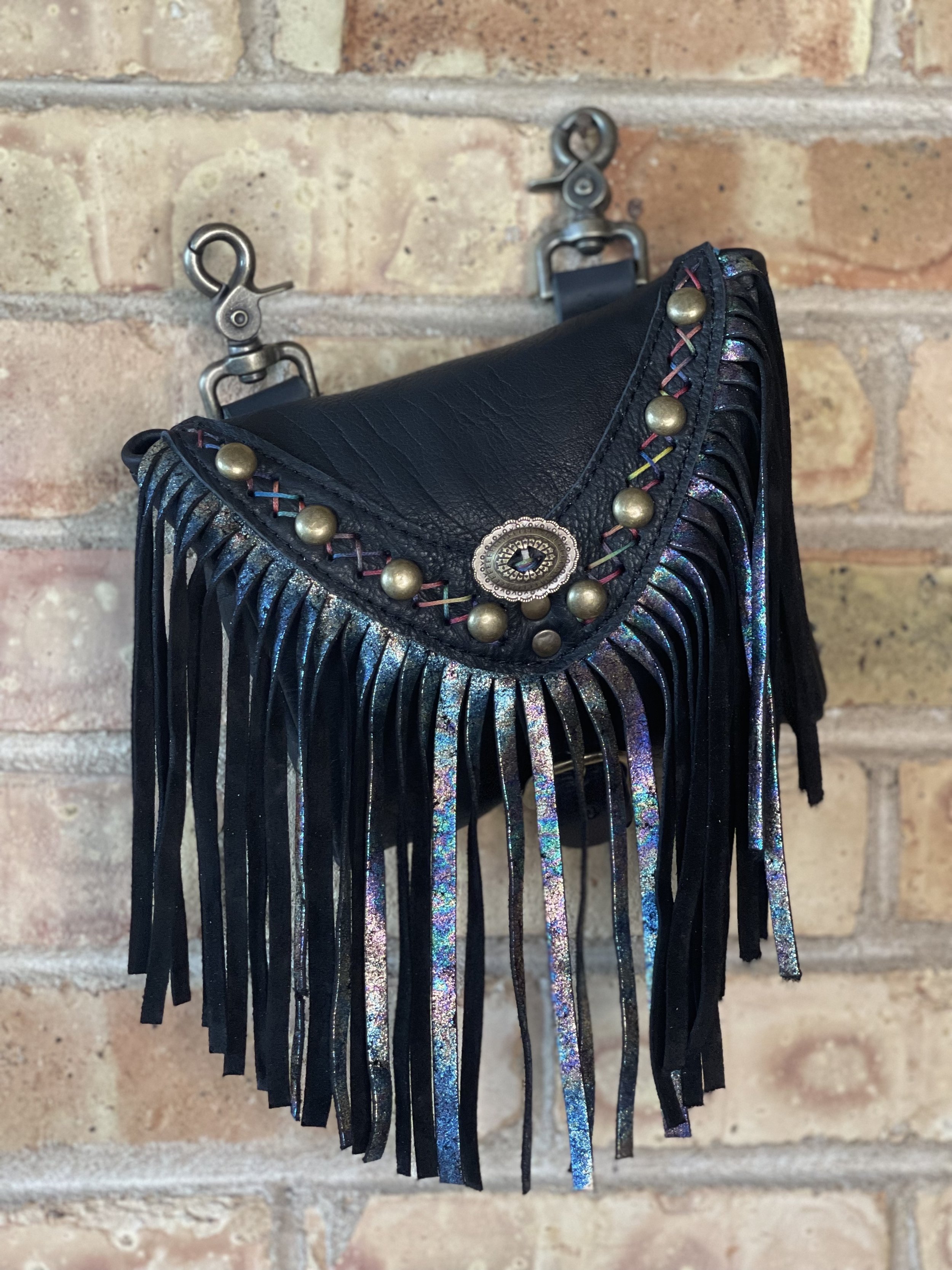 On The Road Hip Bag in Black Bison, Antique Marble Fringe, Rainbow Criss Cross Handstitching, Studs, and a Concho