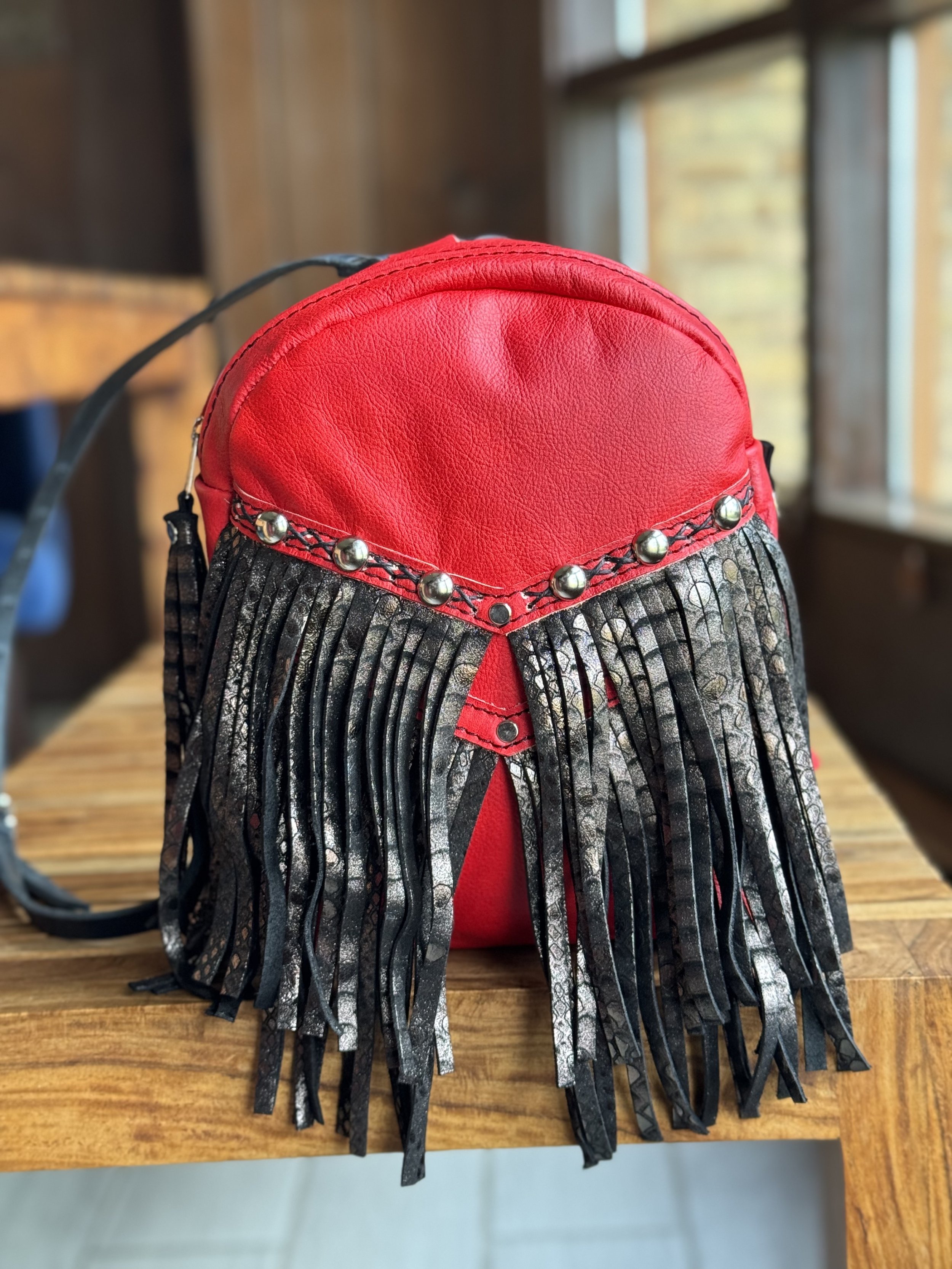 Hand Dyed Red leather body, Black Python leather fringe, Black Criss Cross Handsitching, Nickel hardware, Studs, Flair D Ring - Mini Backpack