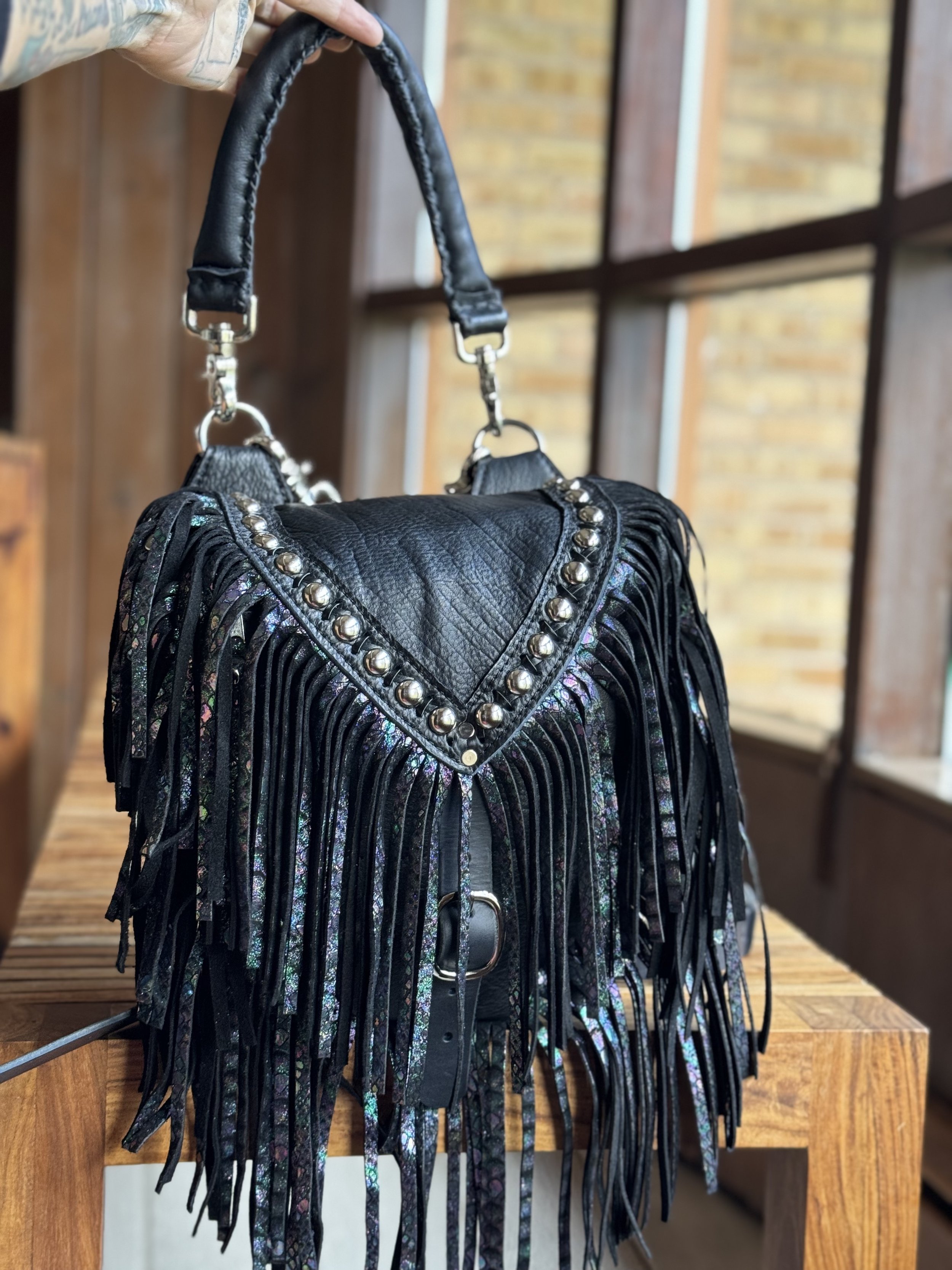 Black bison leather, Rainbow Snake Skin leather fringe, Nickel hardware, Studs, Black Lace X Stitch, Clip On Black Bison leather Puffy Handle, Flair D Ring - Mini Brittany Convertible Bag