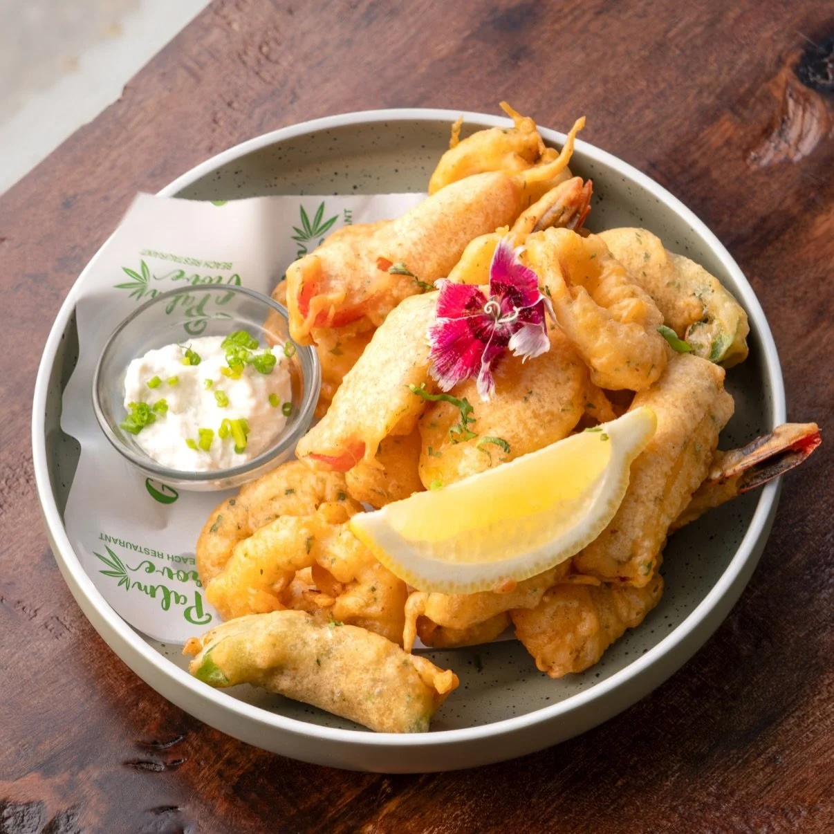Savoring the ocean&rsquo;s bounty! 
Dive into our Fritto Misto, a delightful mix of crispy prawns and tender squid, perfectly seasoned and fried to golden perfection. A taste of the sea on every plate!

#ashvem #SeafoodLovers #FrittoMisto