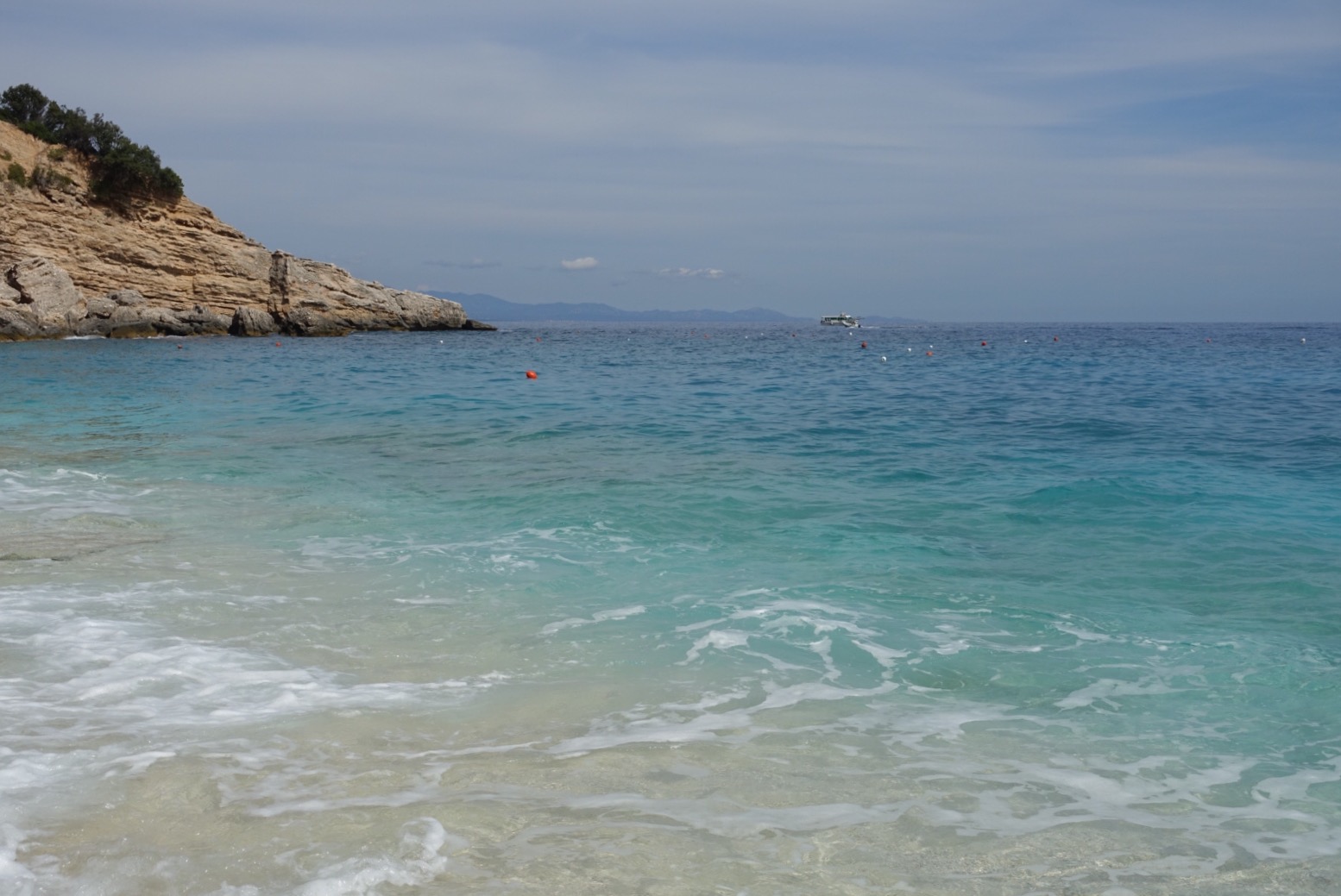 Our first stop. There were only two other people on the beach so it was lovely and quiet. Rocks make it a bit challenging to comfortably walk across and we'd left our thongs in the boat so we had to suck it up.