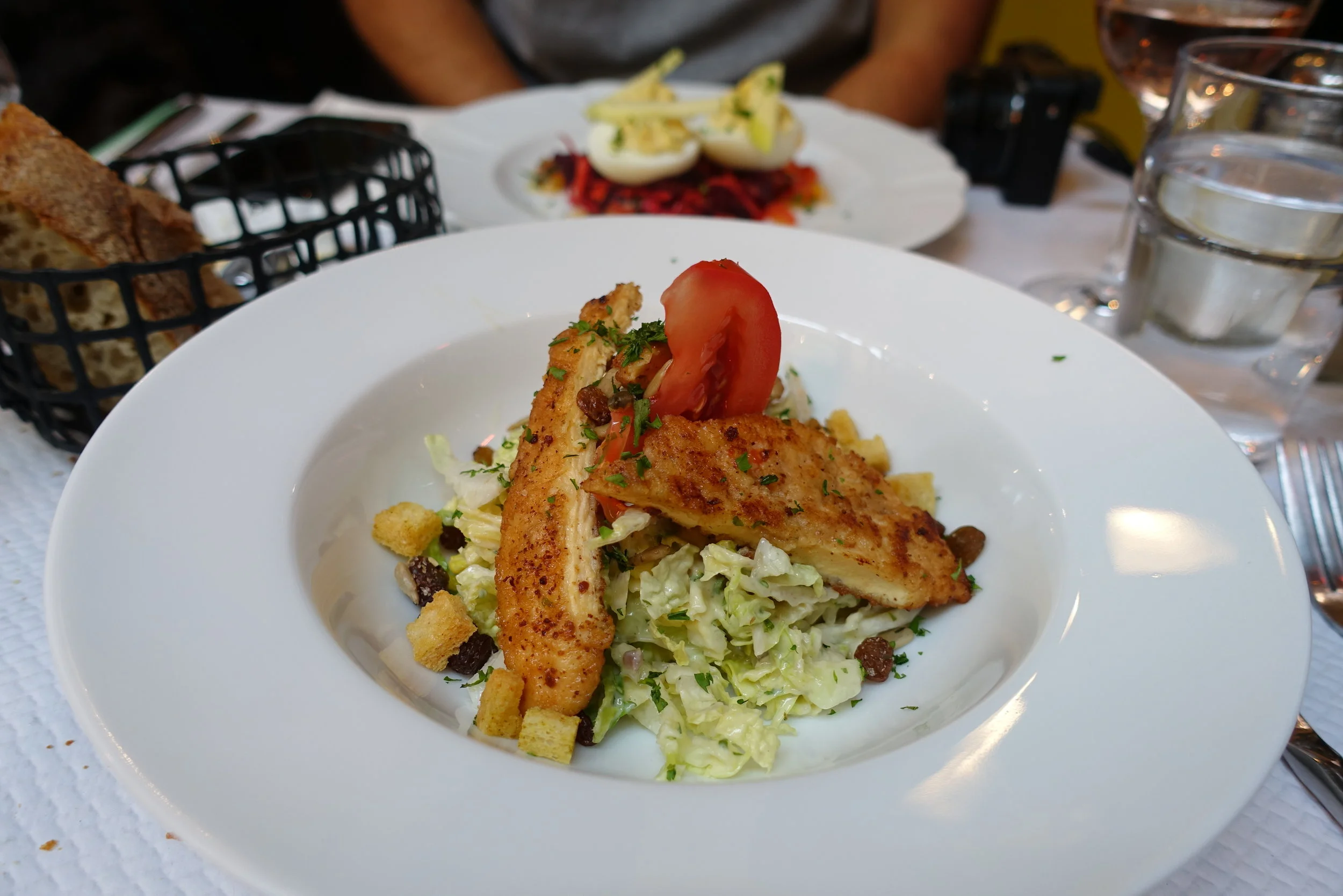 We opted for their €15 lunch menu which consisted of an option of two entrees and two mains. I couldn't read the menu to save my life so we had one of each.This was a Caesar salad of sorts with chicken. I tell you what, the French know how to do sal…