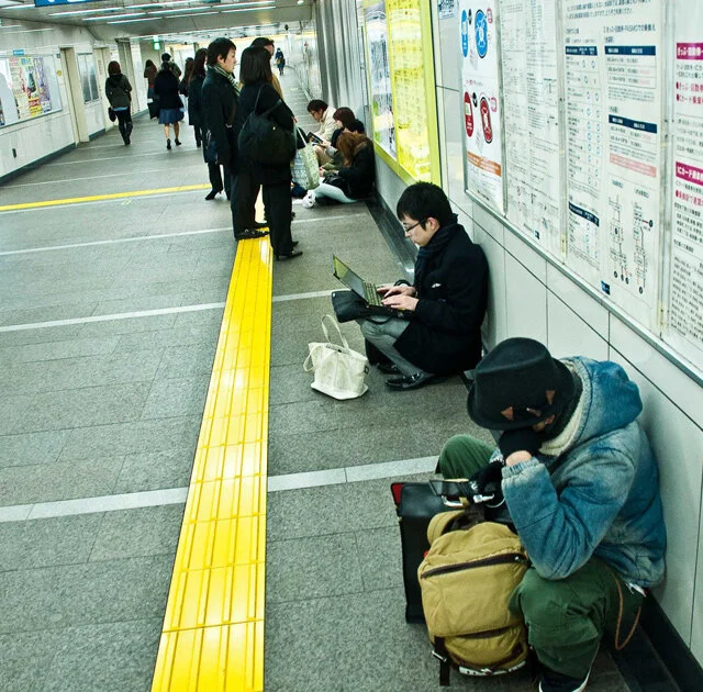 Mobiles and laptops keeping people occupied whilst waiting for who knows how long.