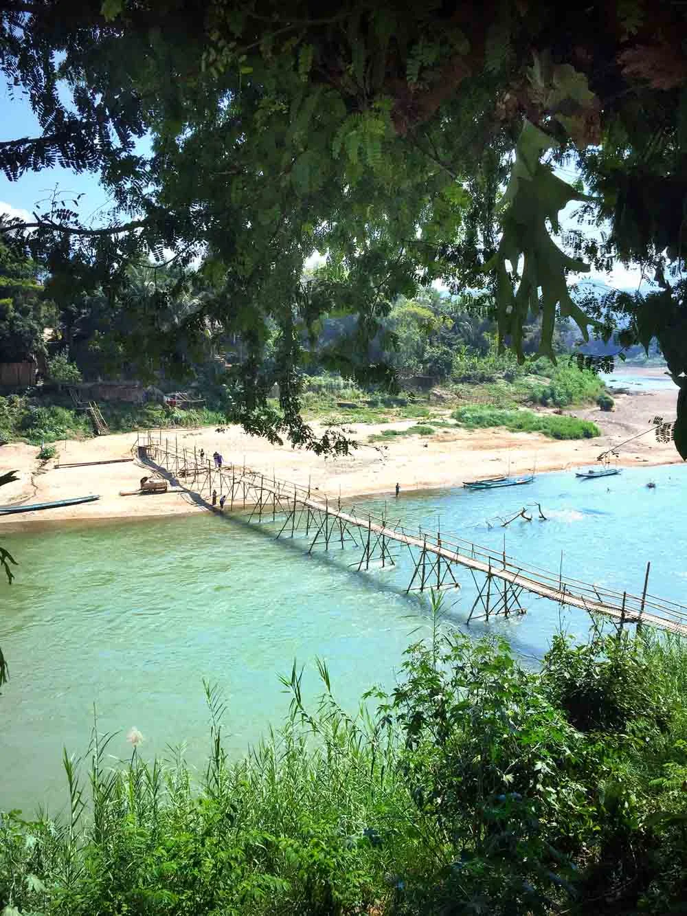 A bamboo bridge over the Nam Khan River. It's knocked down every rainy reason and rebuilt after the water levels fall. 