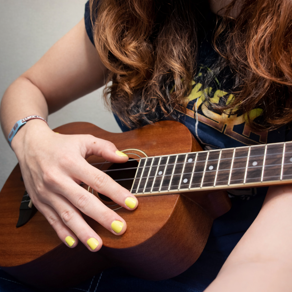 Student playing ukulele during private lesson in Merrimack NH