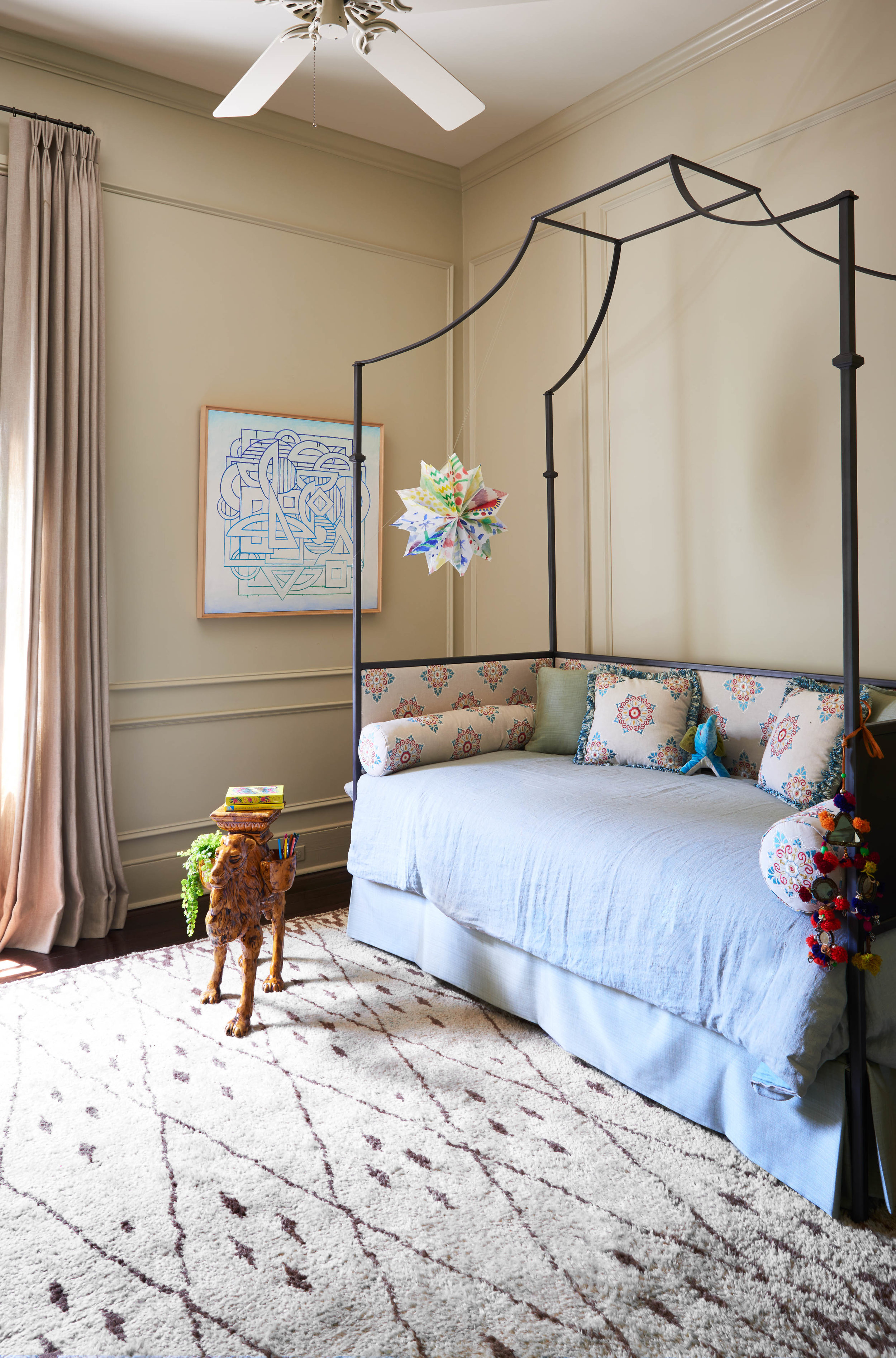 A custom-forged iron daybed in one of the girls’ rooms.