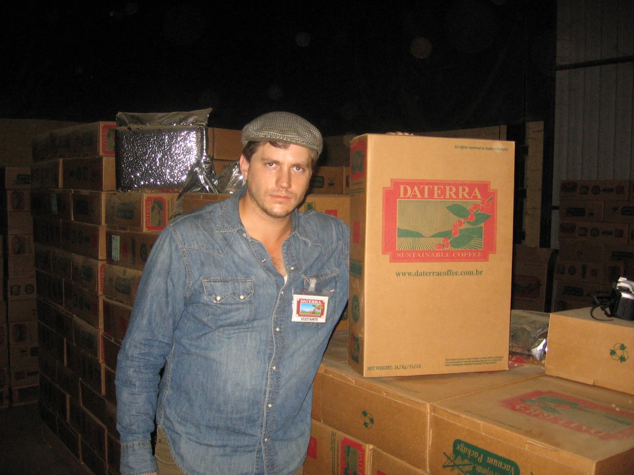 A photo of a much younger me at Daterra’s warehouse in Patrocinio, learning about their Penta System for quality control, including the vacuum-sealed boxes.