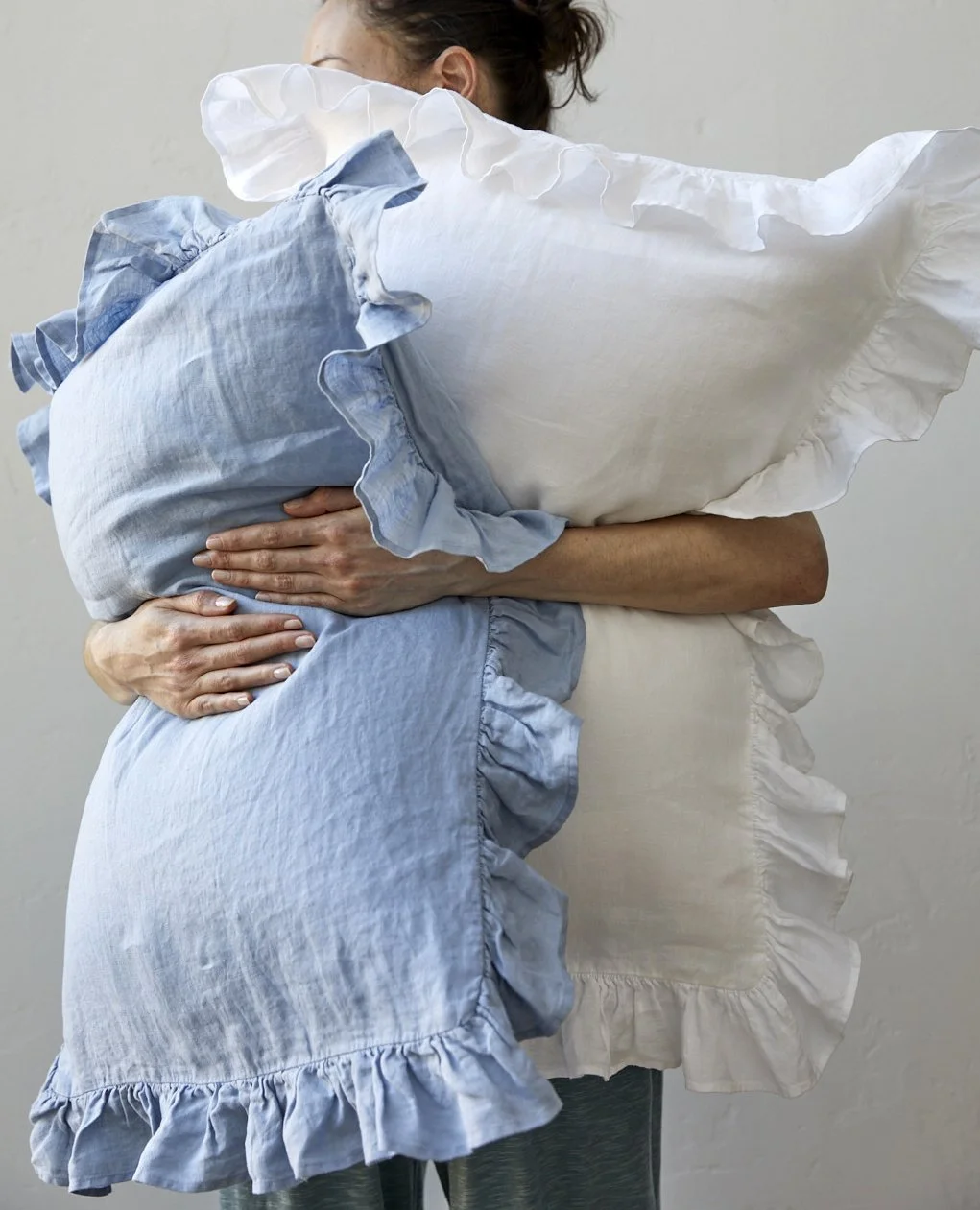 GH Model holding pillows.jpg