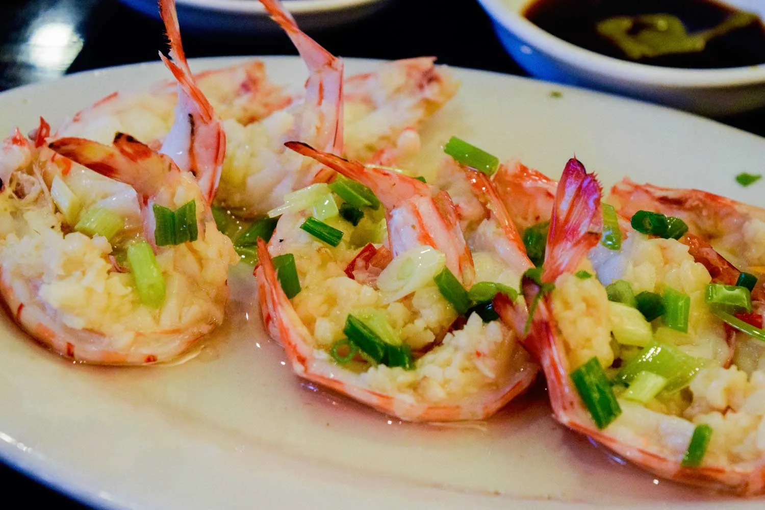 Shrimp topped with scallion and minced garlic