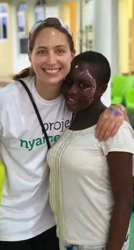 The author with Flora, one of 18 rescued children under PNN.