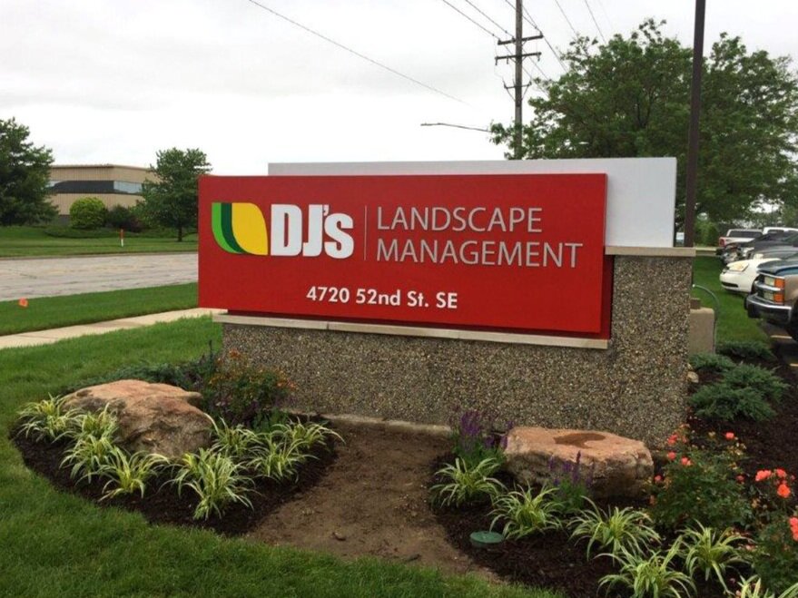  Monument sign with routed aluminum faces, push through acrylic lettering a poured concrete base and an aluminum cap. 