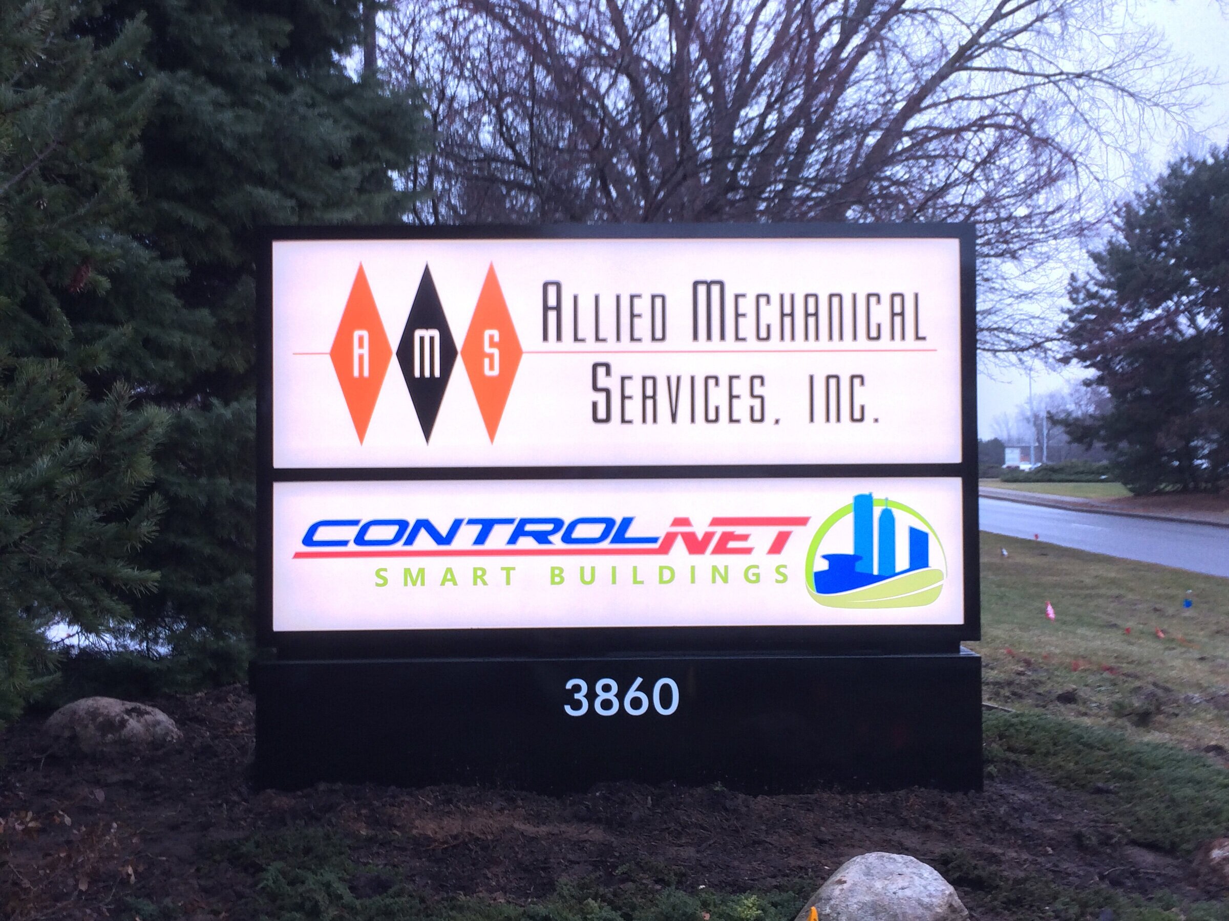  Monument sign with polycarbonate faces, vinyl graphics and an aluminum base. 