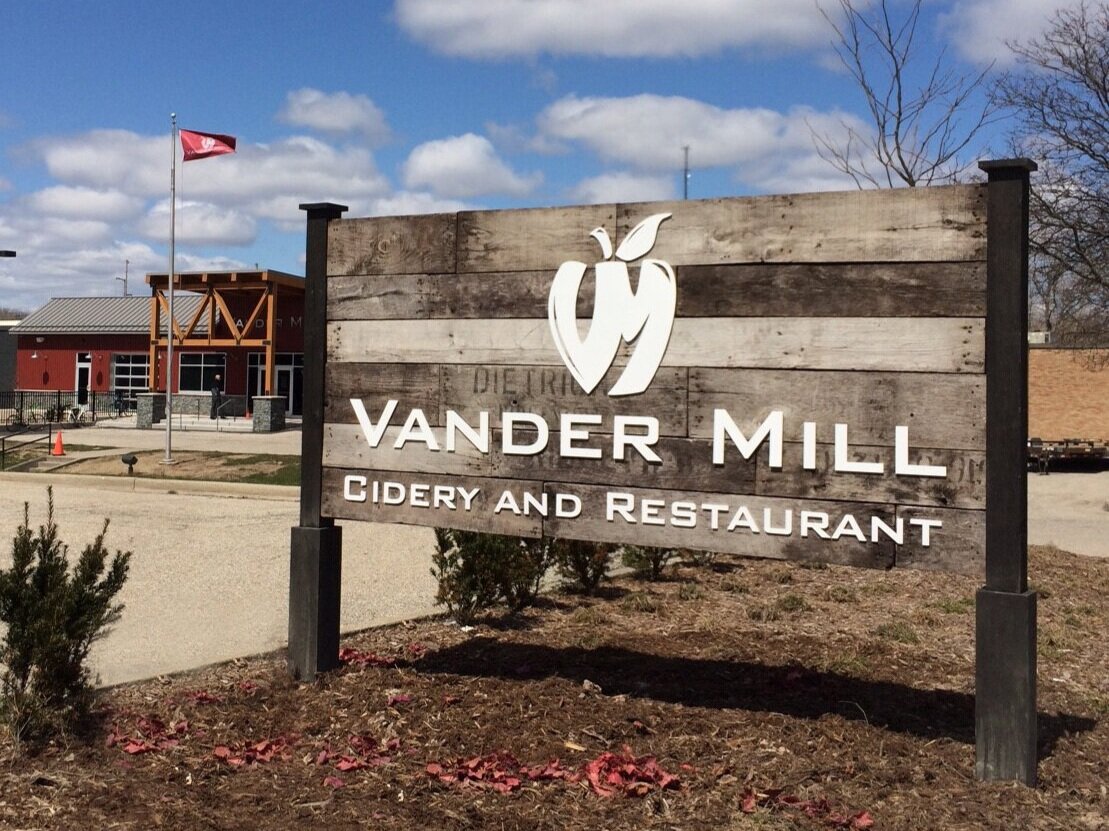  Monument sign with custom apple crate wood background, dimensional lettering and stained wood posts. 