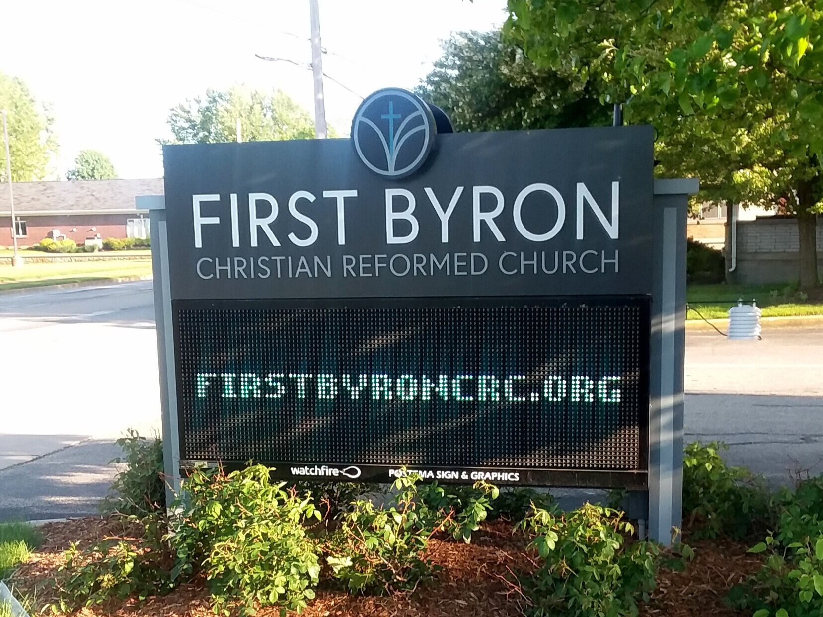  Monument sign with routed aluminum faces, push through acrylic lettering with a dimensional logo disk, external aluminum posts and a Watchfire 16mm display. 