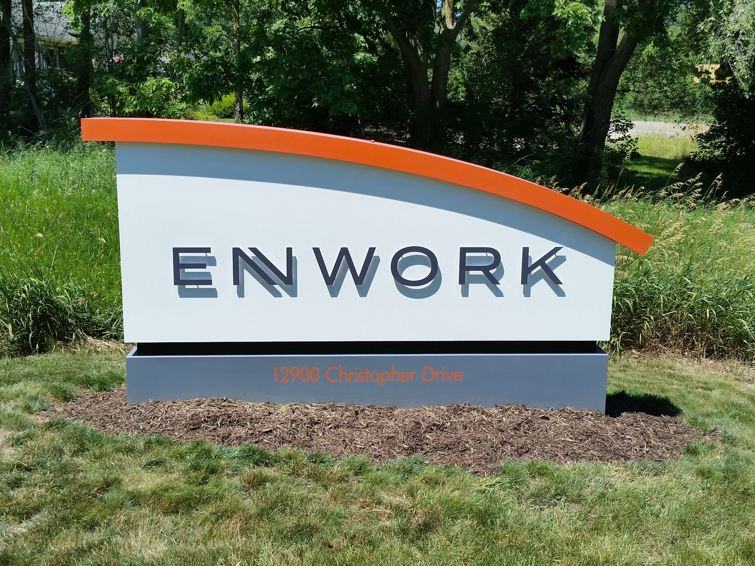  Custom aluminum fabricated monument sign with CNC routed plate aluminum lettering and an arched top. 