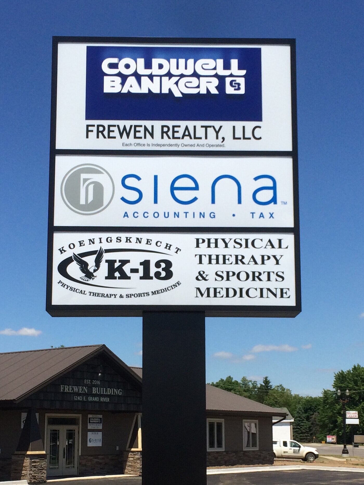  Simple multi-tenant pylon sign with polycarbonate faces and a pole cover. 