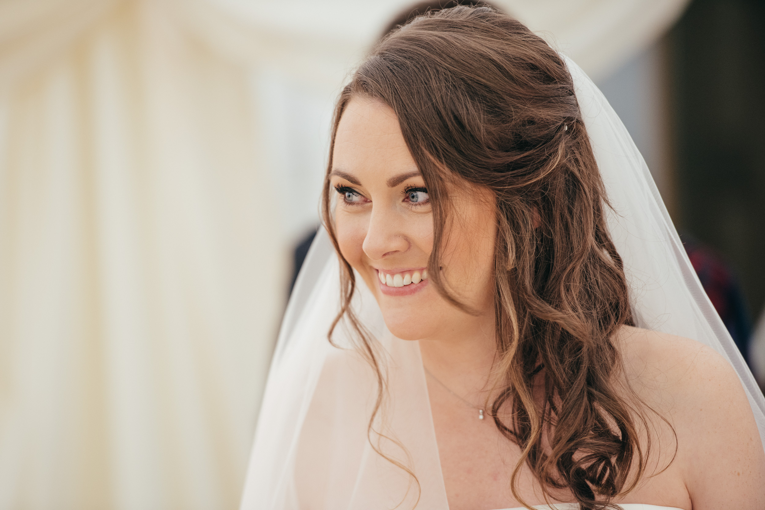 Bride laughing during ceremony