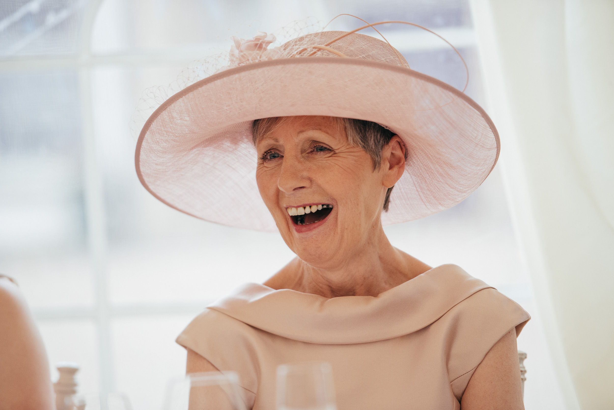 Candid laughter during wedding speeches