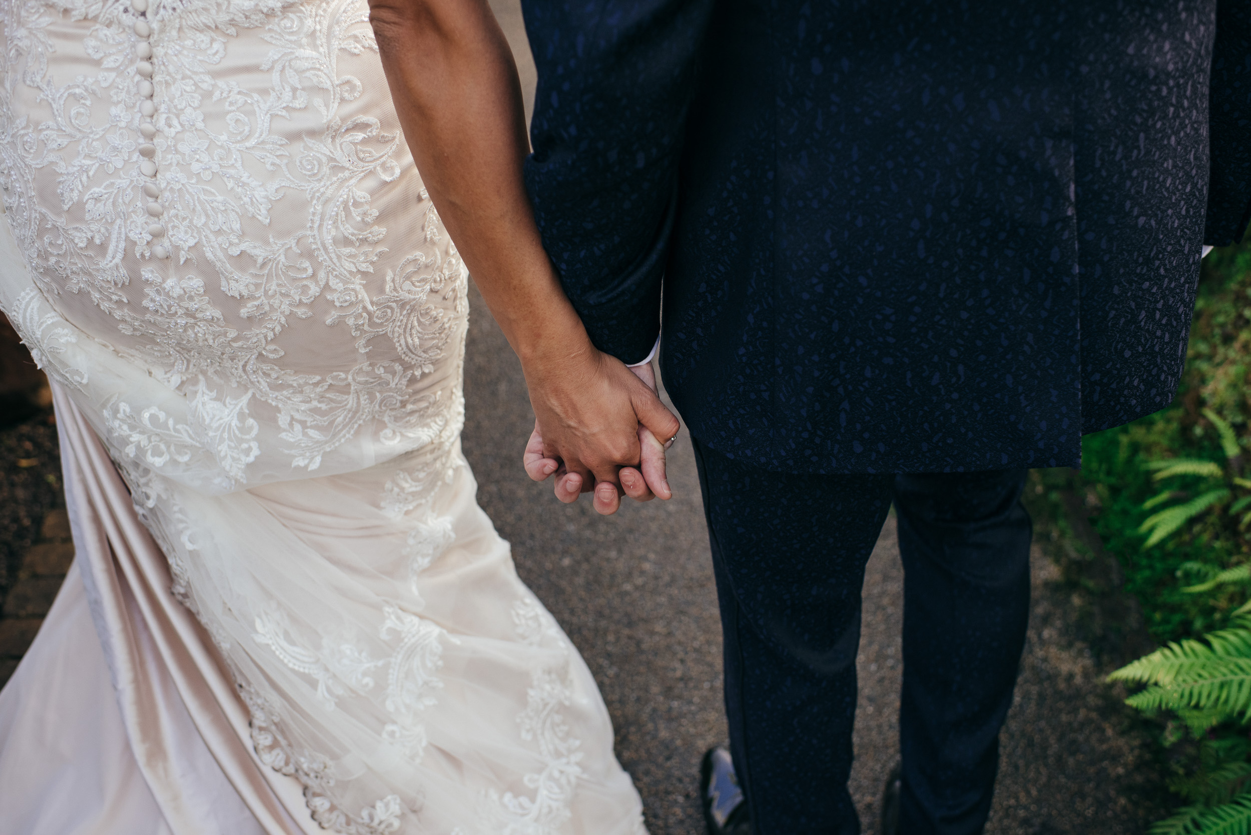 Bride and groom holding hands