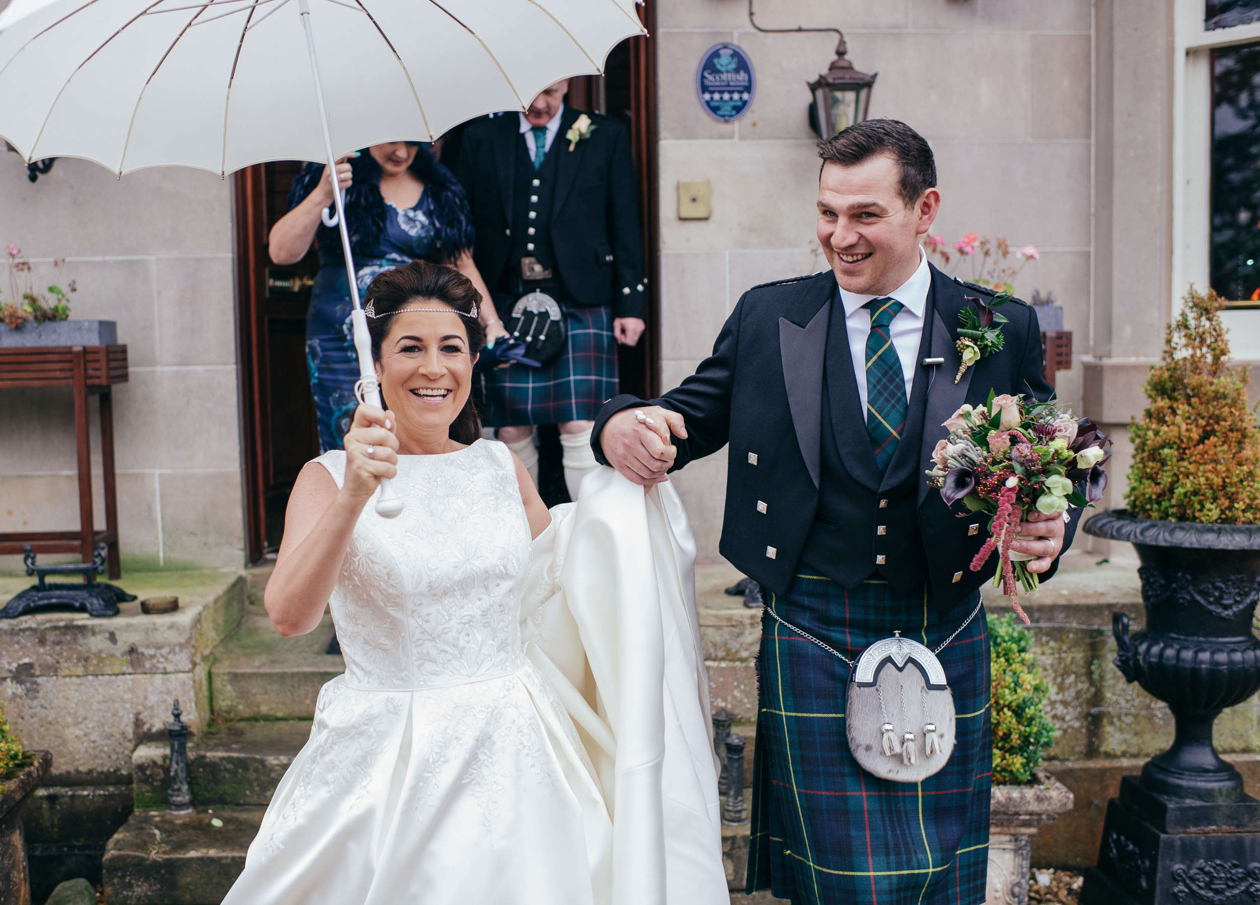 Bride and groom in the rain