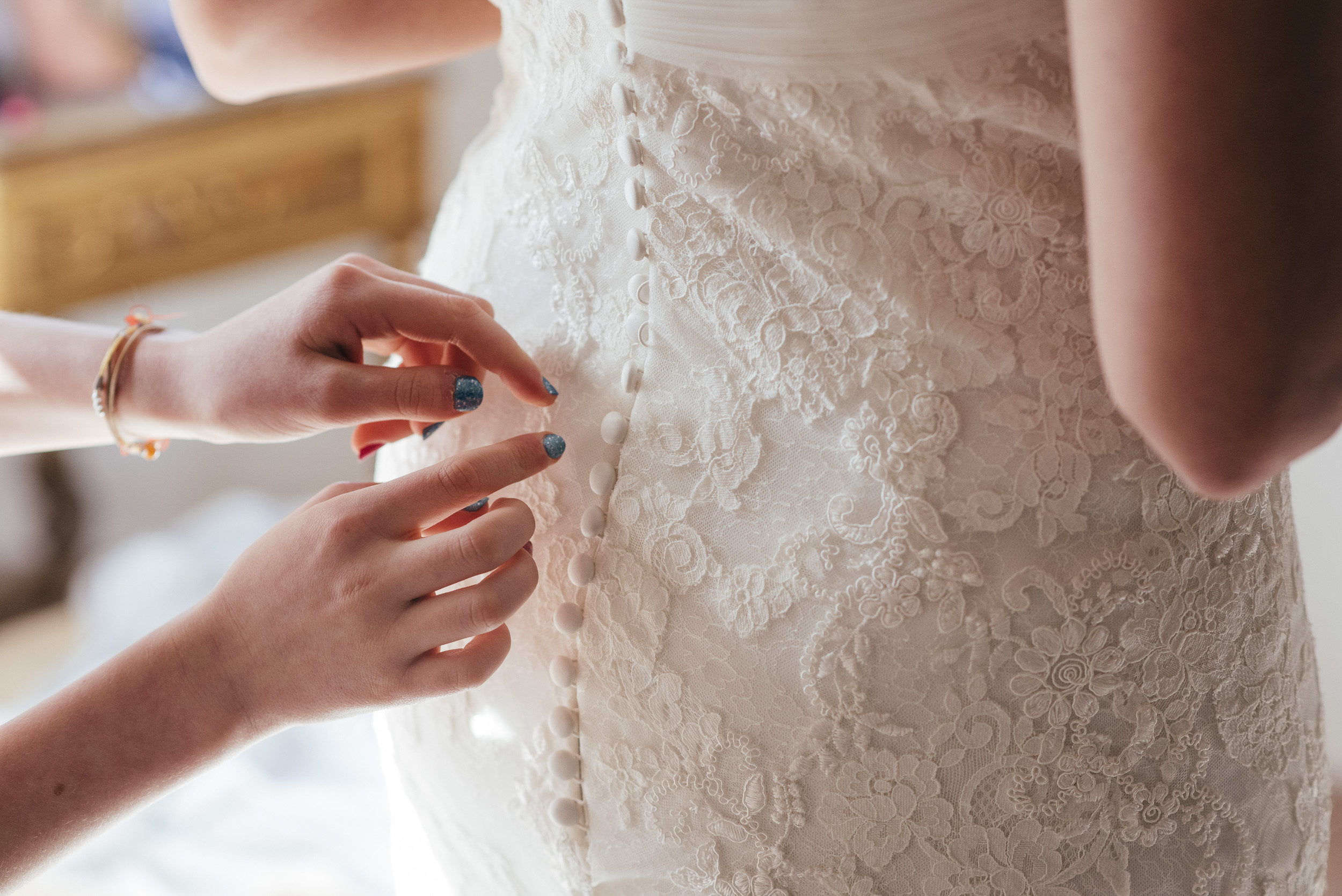 Putting on wedding dress