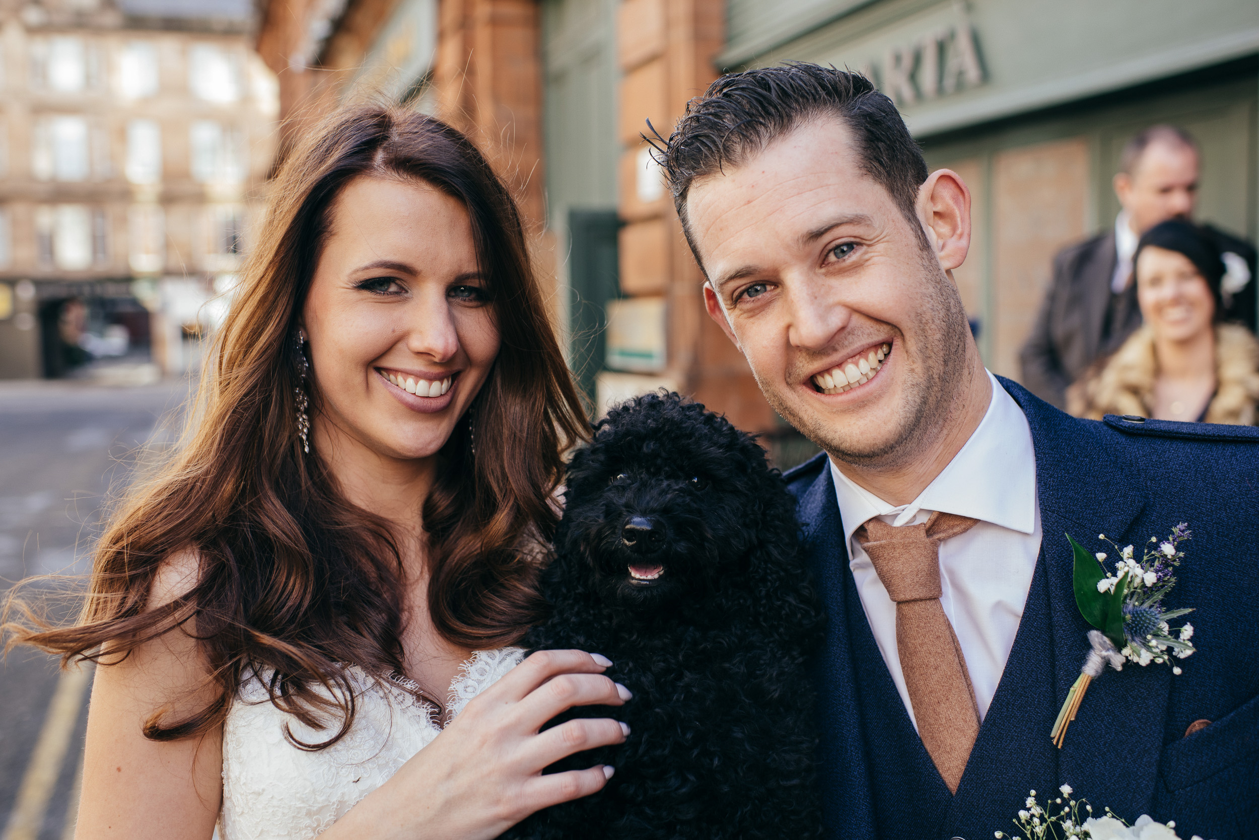 Bride and groom with dog 