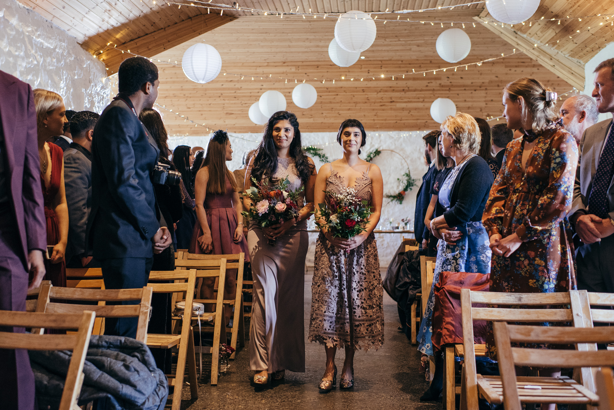 Bridesmaids walking down aisle