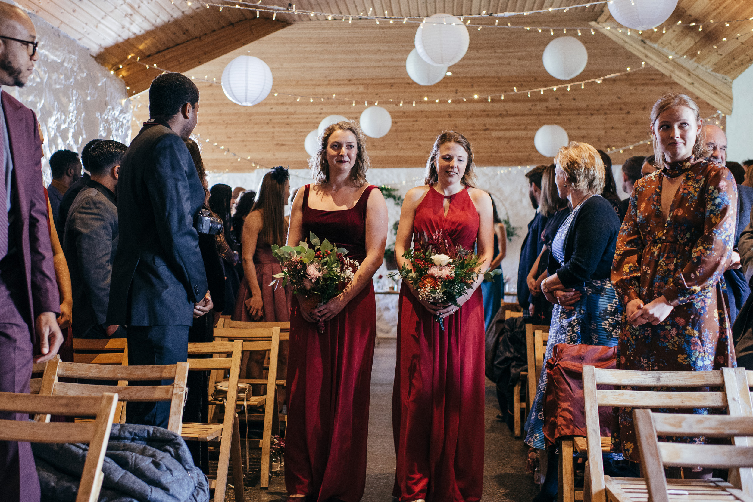 Bridesmaids walking down aisle