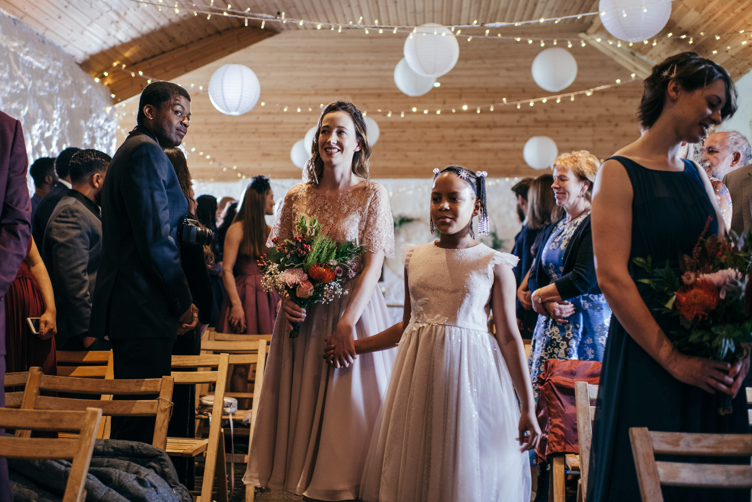 Bridesmaids walking down aisle