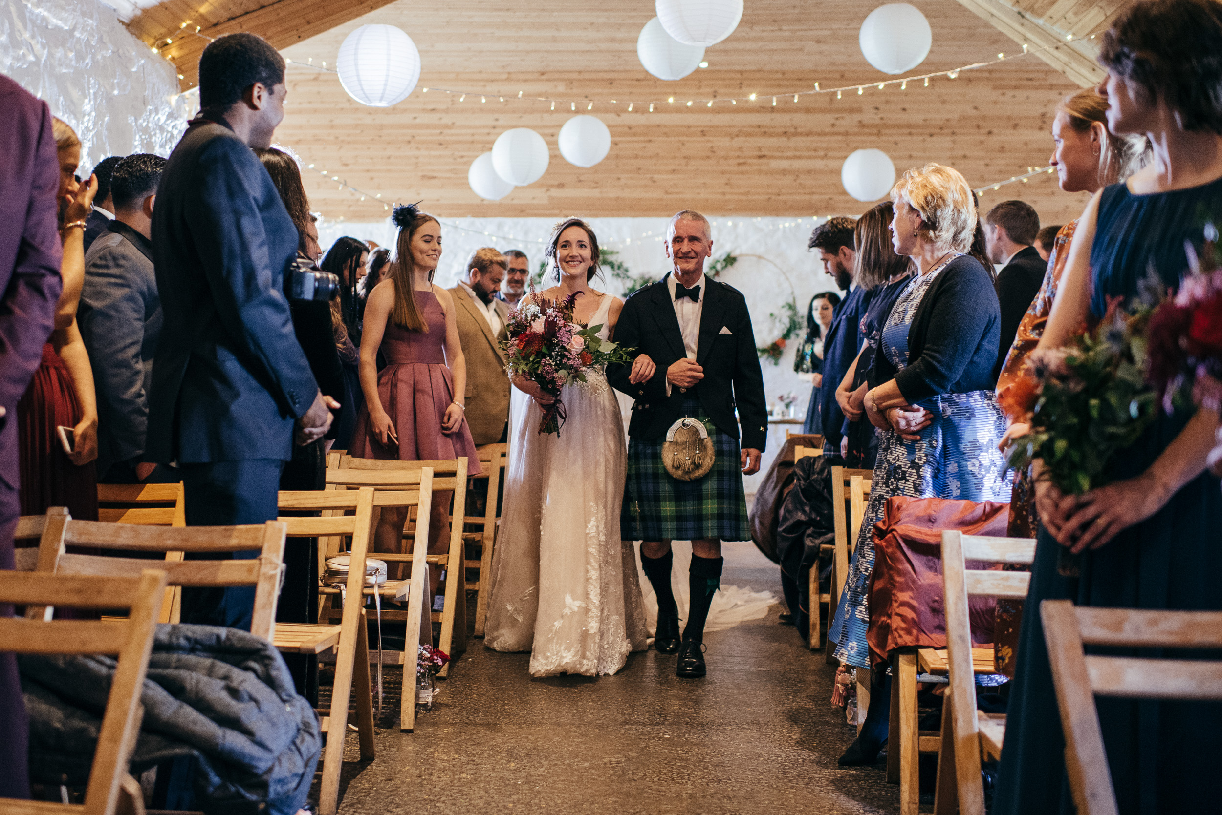 Bridesmaids walking down aisle