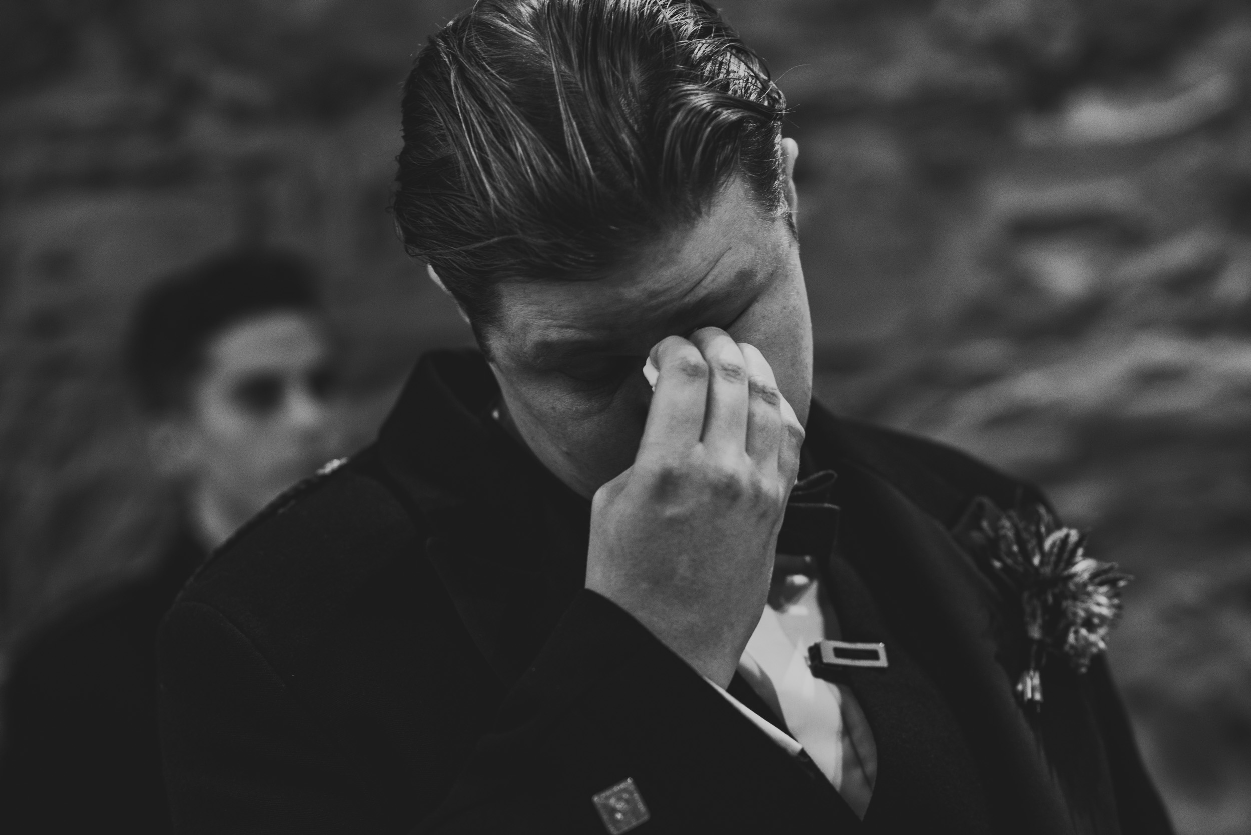 Emotional groom at wedding