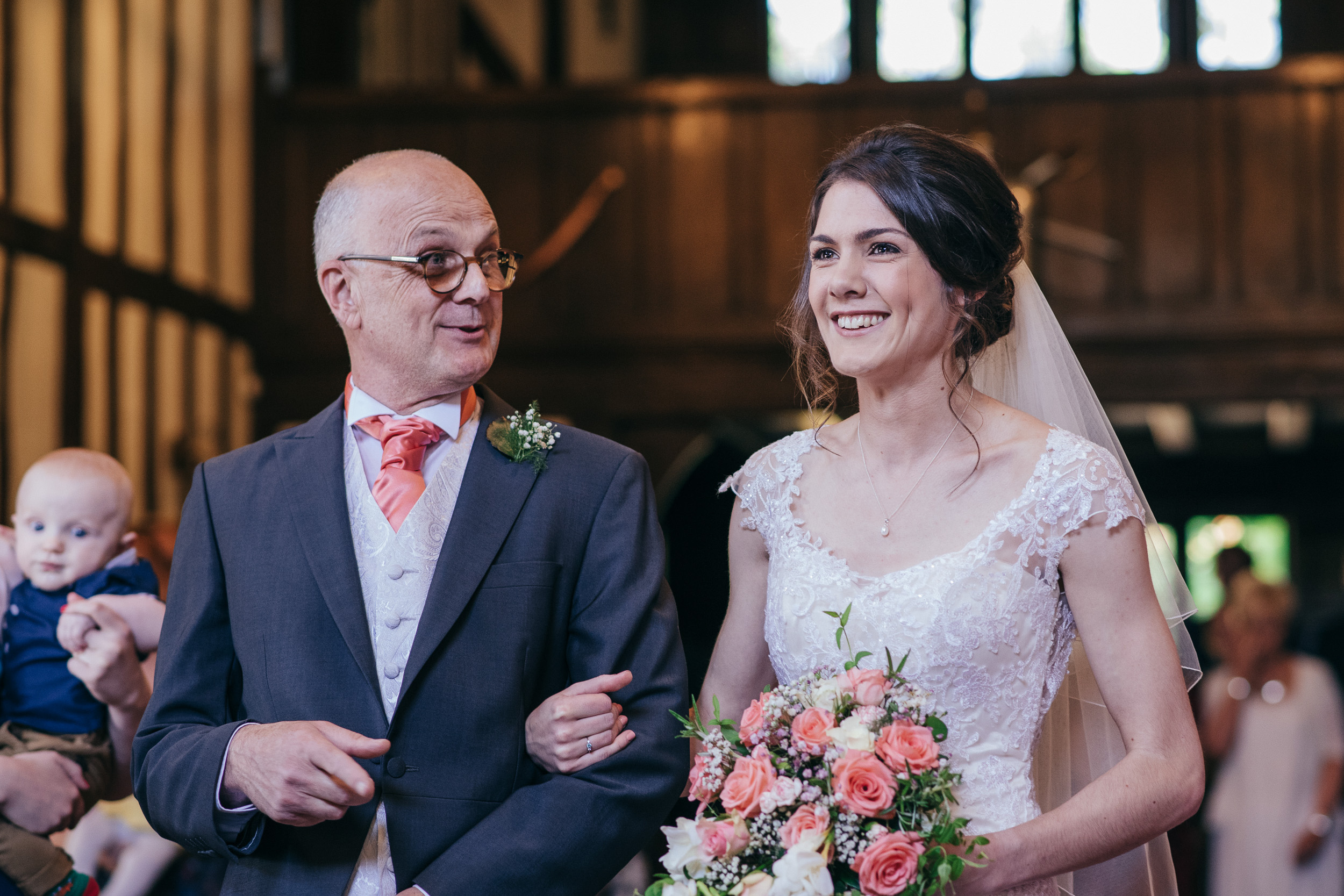 Bride and father walking down aisle