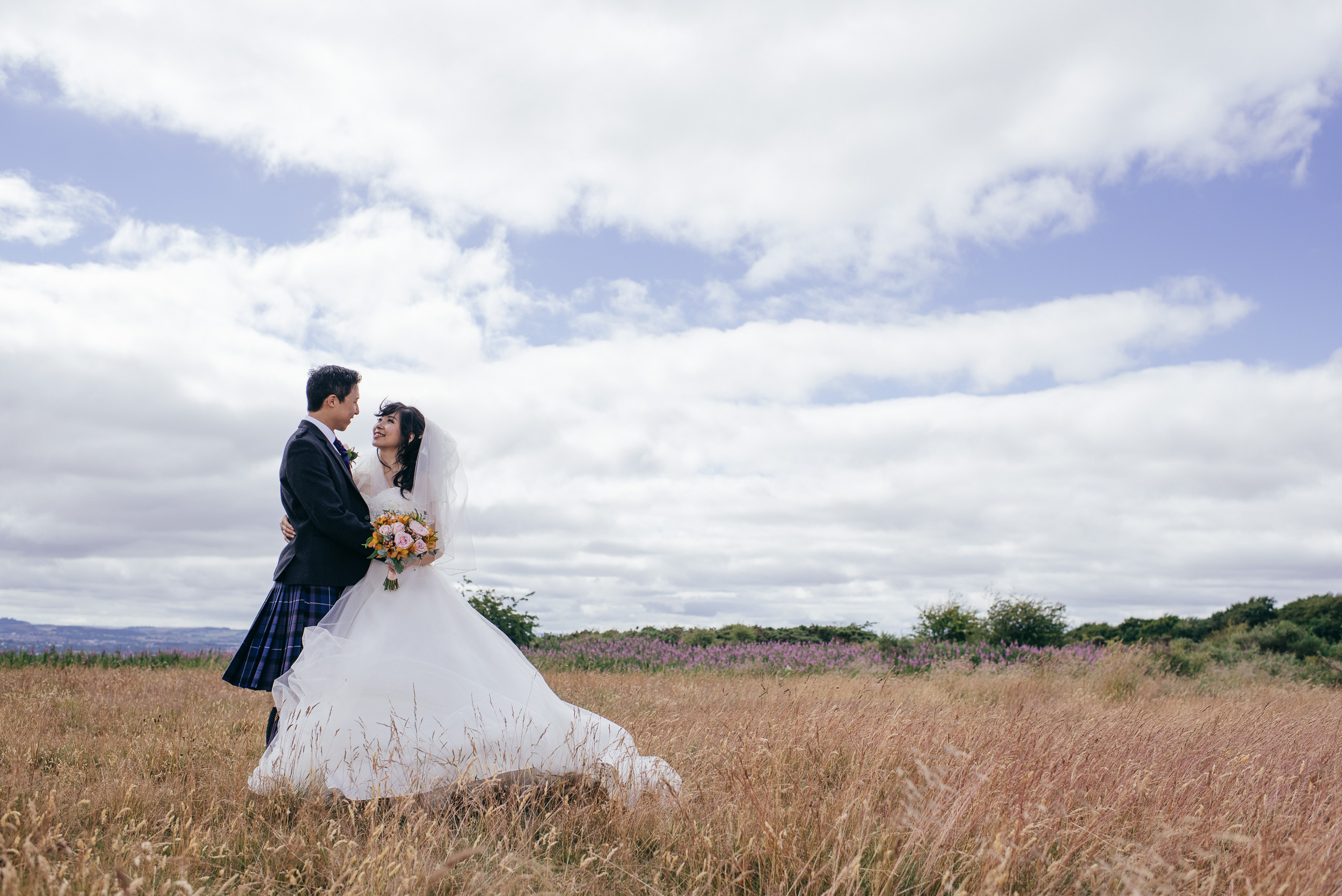 Chinese Scottish wedding in a field