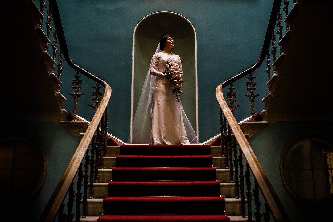 Dramatic bride portrait on stairs