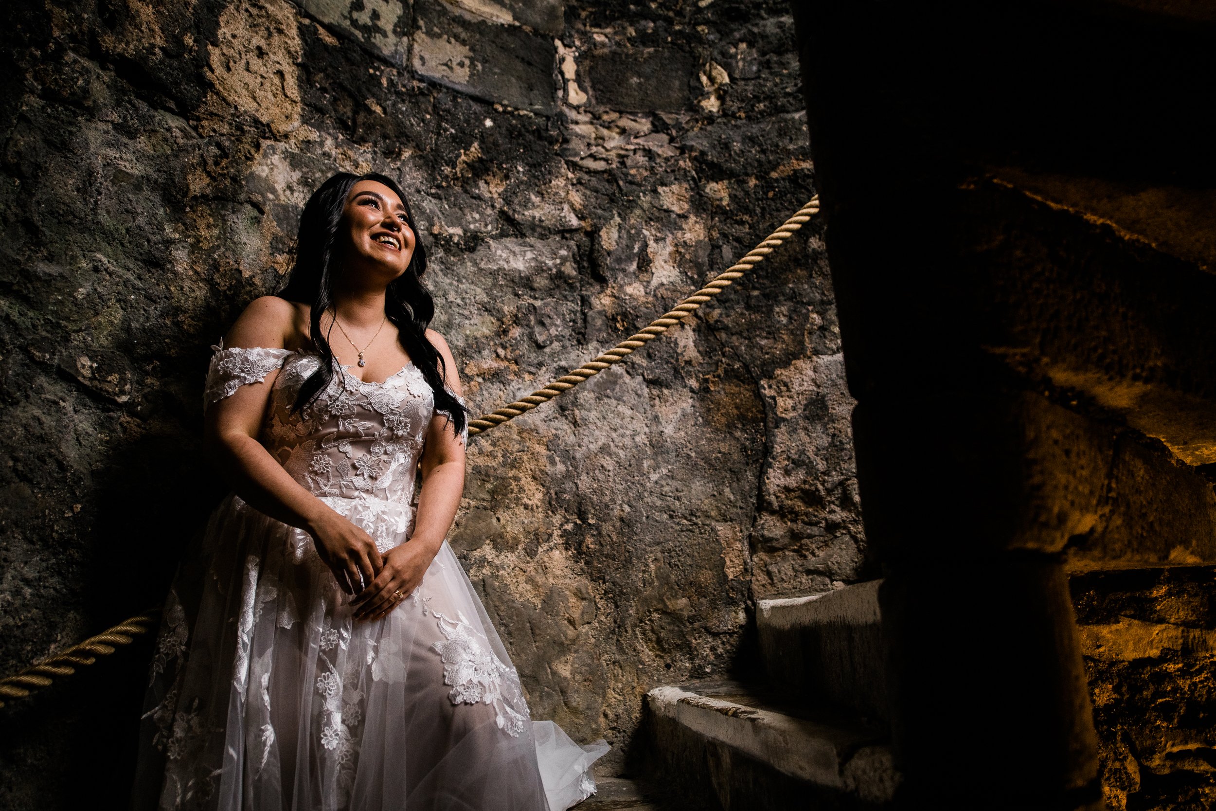 Bride on stairs in keep at Dundas Castle