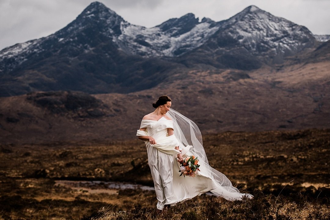 How awesome does Quinn look amongst the beautiful Skye wilderness? 

This has got everything I love about shooting wild Scottish elopements. Mountains, snow, wind, a moody sky, a flowing dress and an amazing bride. 

#scottishelopment #skyeelopement 