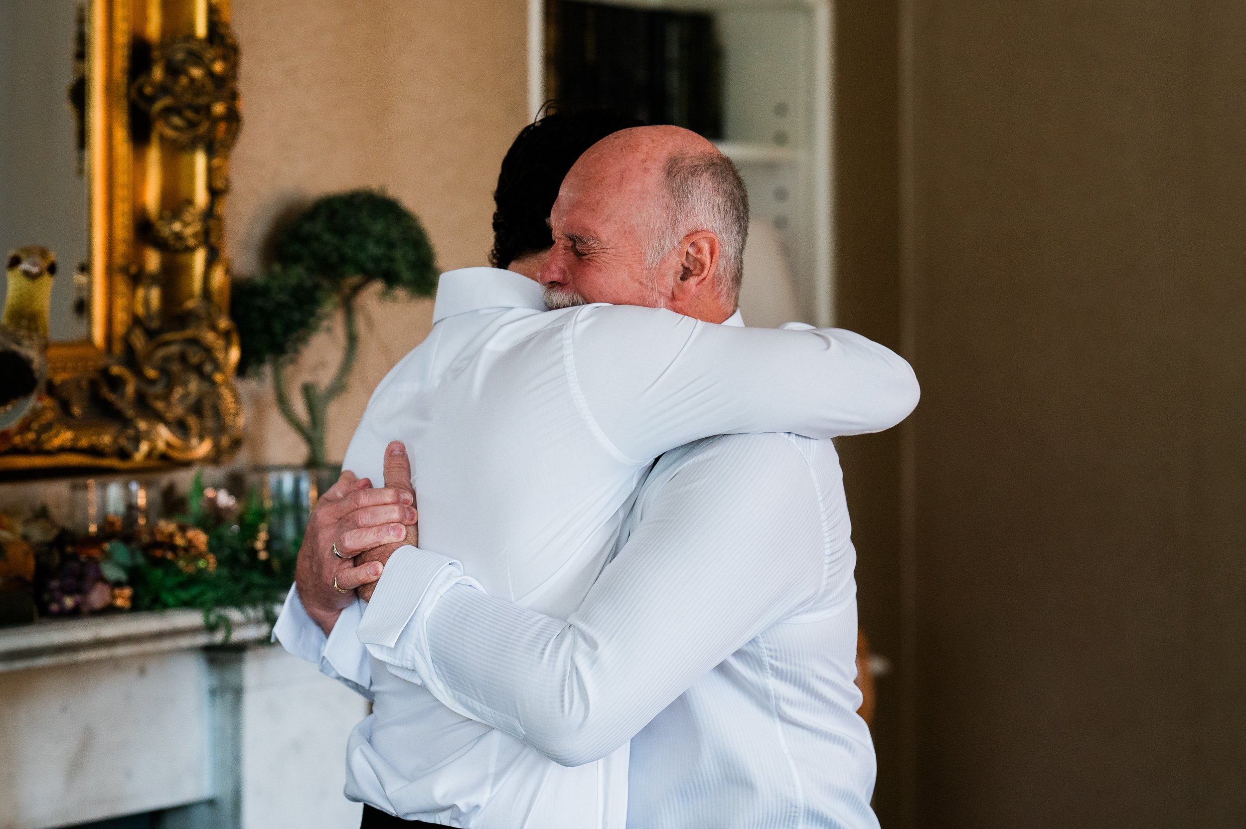 Father of the groom helping son