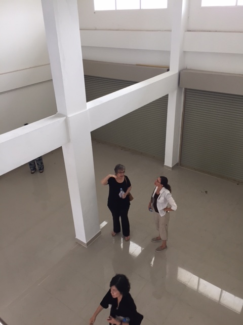 Bonita shows us around the shop house. The bottom floor level will hold the restaurant.
