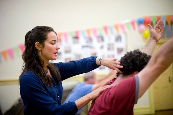 Me teaching donation-based yoga at a local church, 2010.
