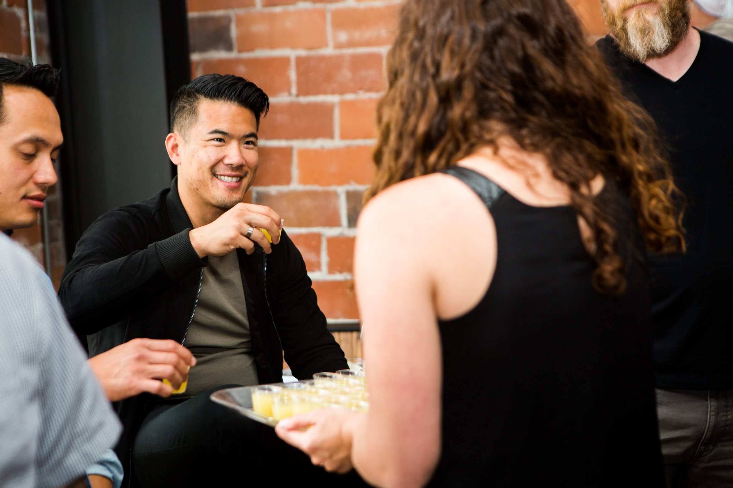Professional cocktail event photography in Lisbon, Portugal, capturing an event guest enjoying a tasting experience. A visual record of the atmosphere, connections, and memorable moments of the occasion.