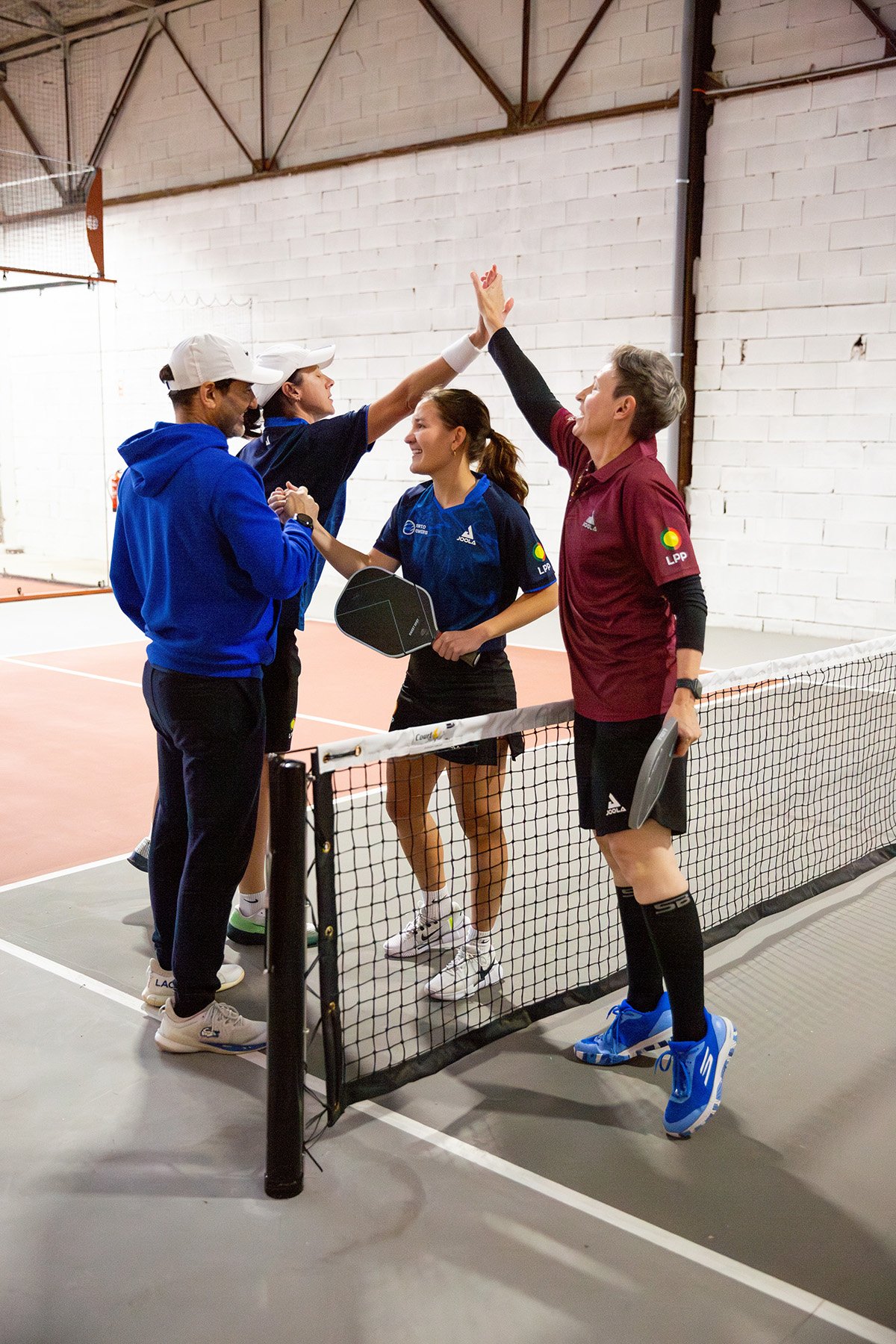 Pickleball league event photography in Lisbon featuring players cheering each other on, connecting, and enjoying a day of competitive sport. Professional sports event photography captures the action, camaraderie, and memorable moments that make pickl