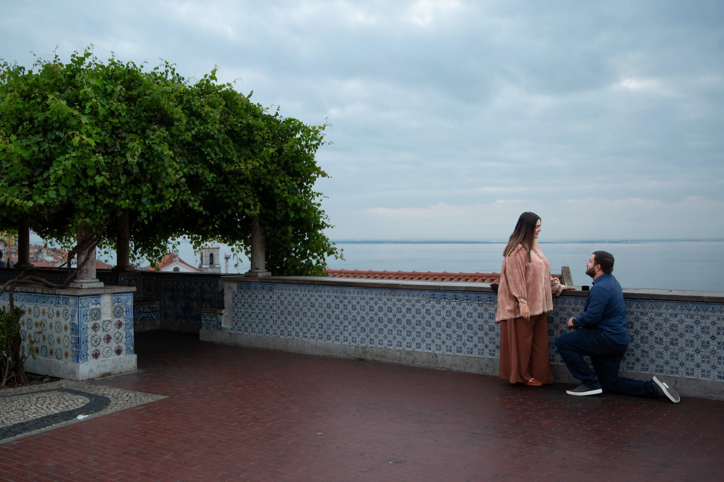 Couples portrait at Miradouro de Santa Luzia in Alfama, Lisbon.