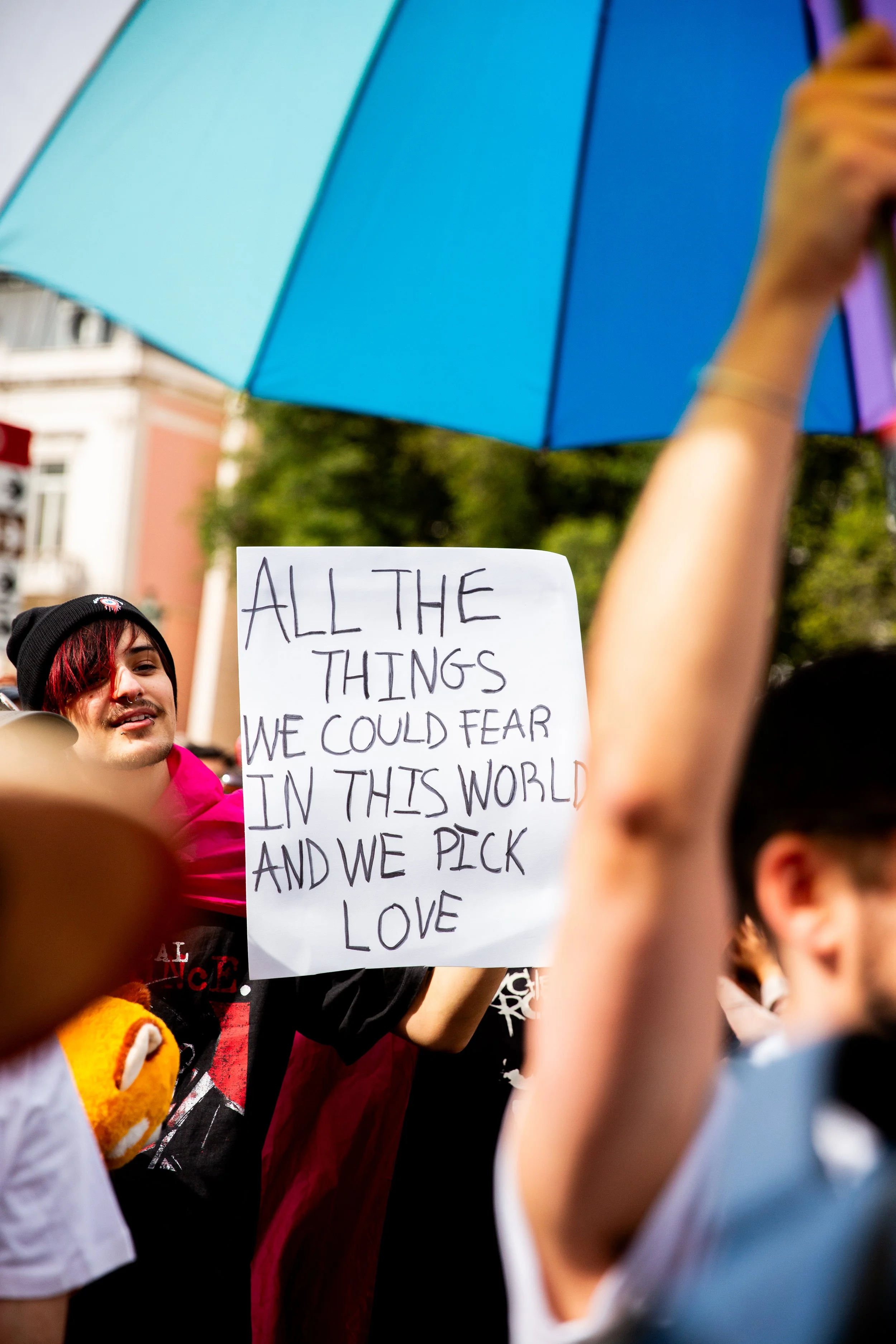 Professional event photography in Lisbon, Portugal, capturing a corporate group participating in a Pride parade in support of LGBTQ+ rights and equality. This image highlights community, visibility, allyship, and the importance of businesses standing