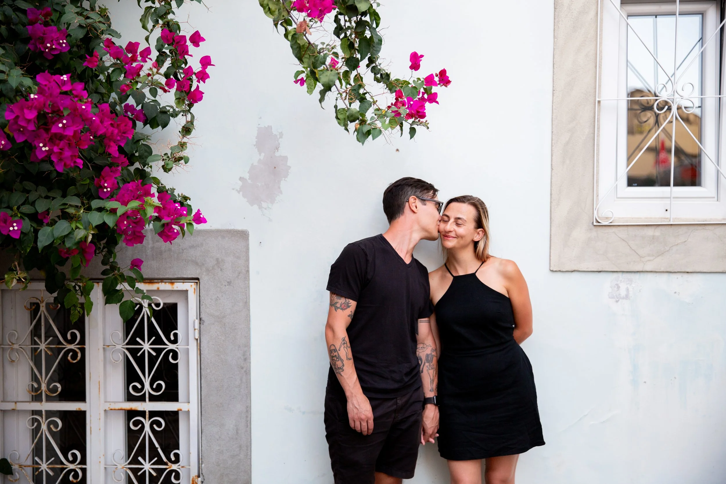 Engagement photography session in Lisbon, Portugal, capturing a newly engaged couple celebrating their love with natural, romantic portraits throughout the city’s beautiful streets historic surroundings and trams.